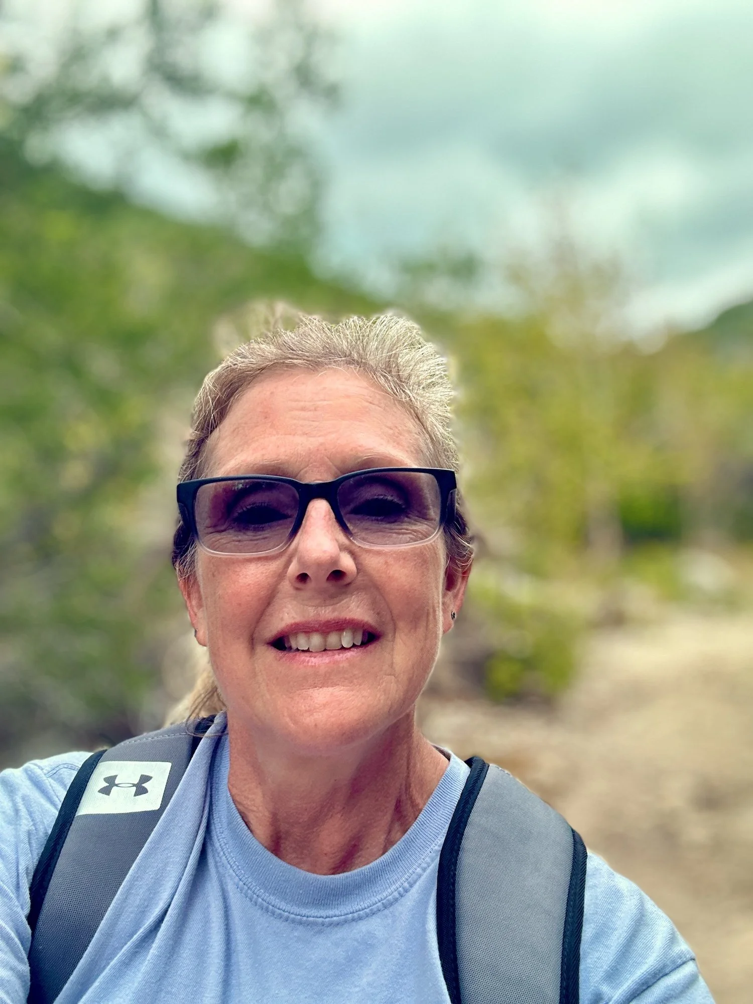 photo of marjorie Lindsay hiking in Lost Maples State Recreational area Texas landscape.
