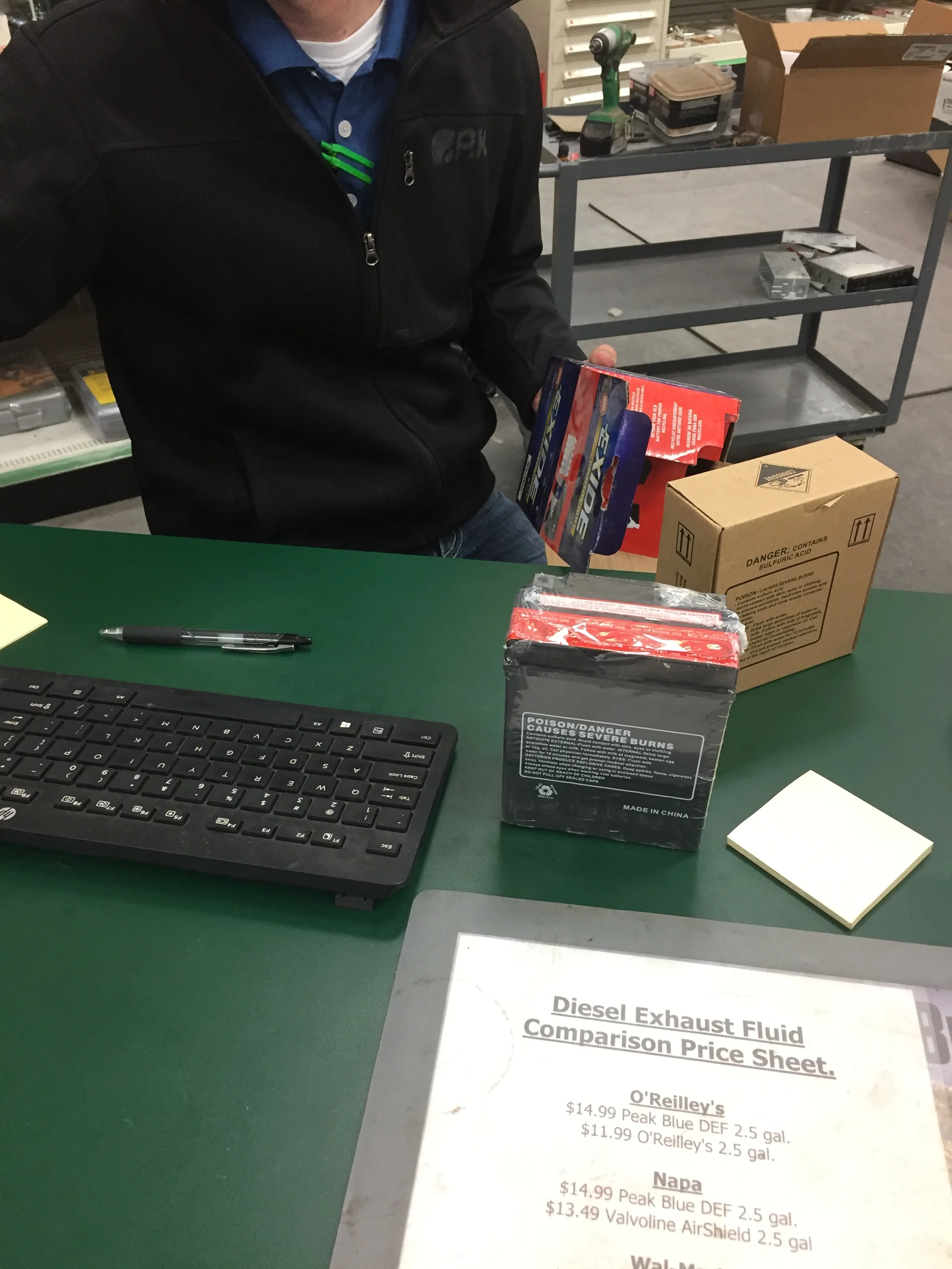 John Deere dealership. Notice the dust on the box in his hand.