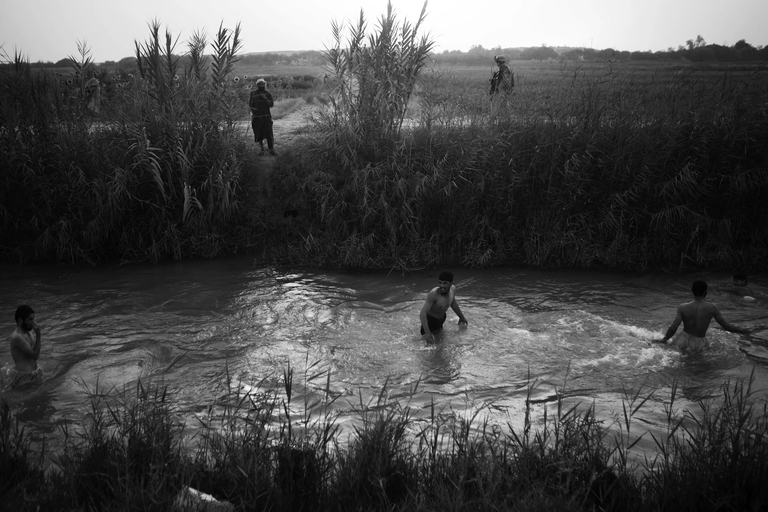  An evening swim in one of the US built canals, Marjah. 