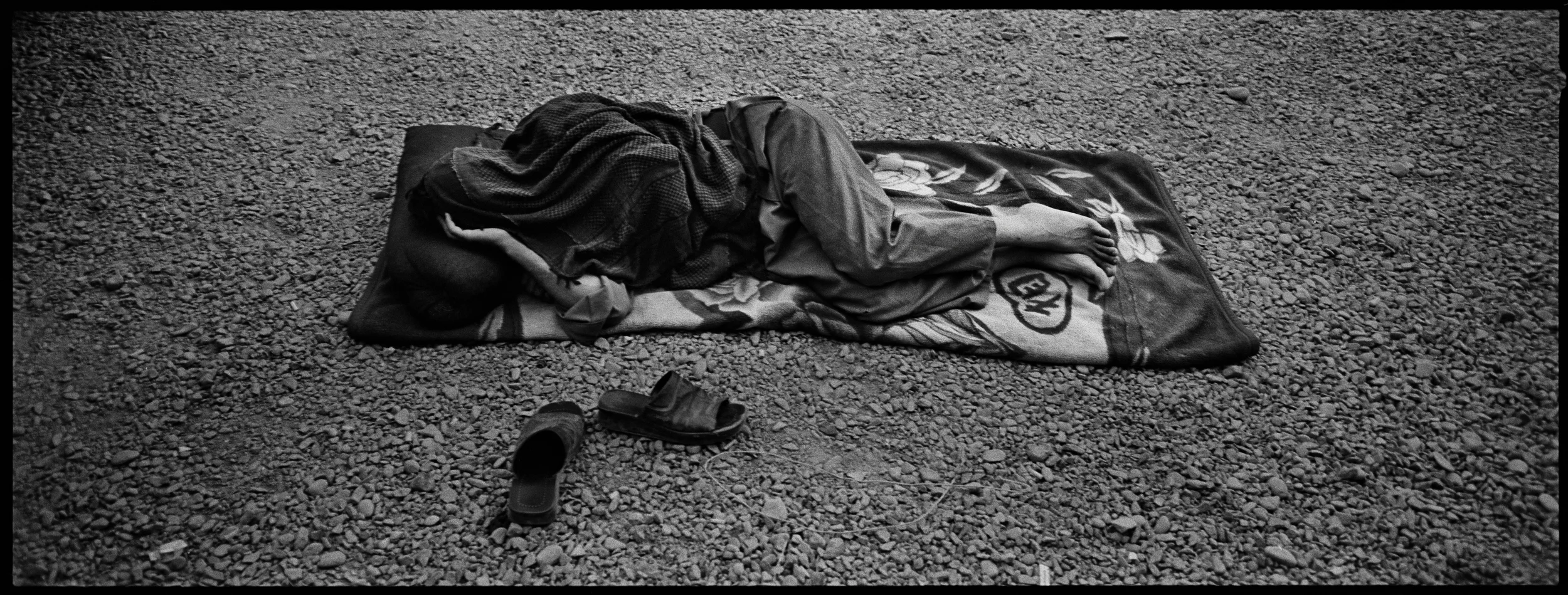  An Afghan Policeman, asleep outside of Kandahar City. 