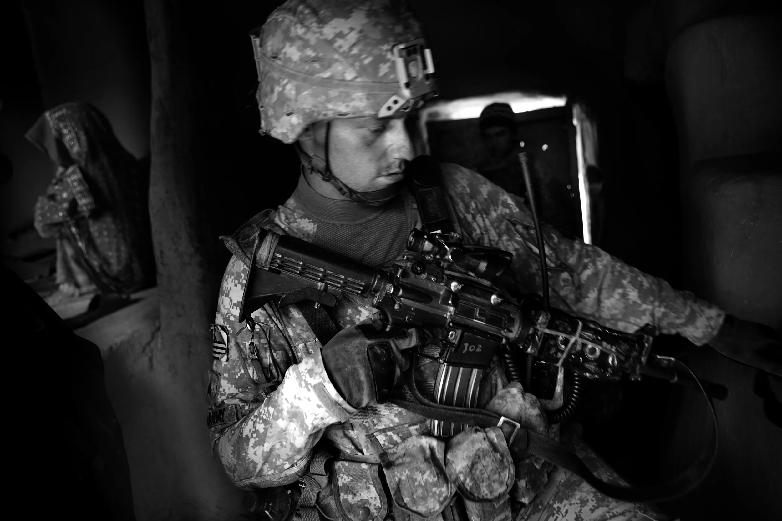  Sgt. Thomas Burke conducts a search during an air assault in the Tangi Valley. 