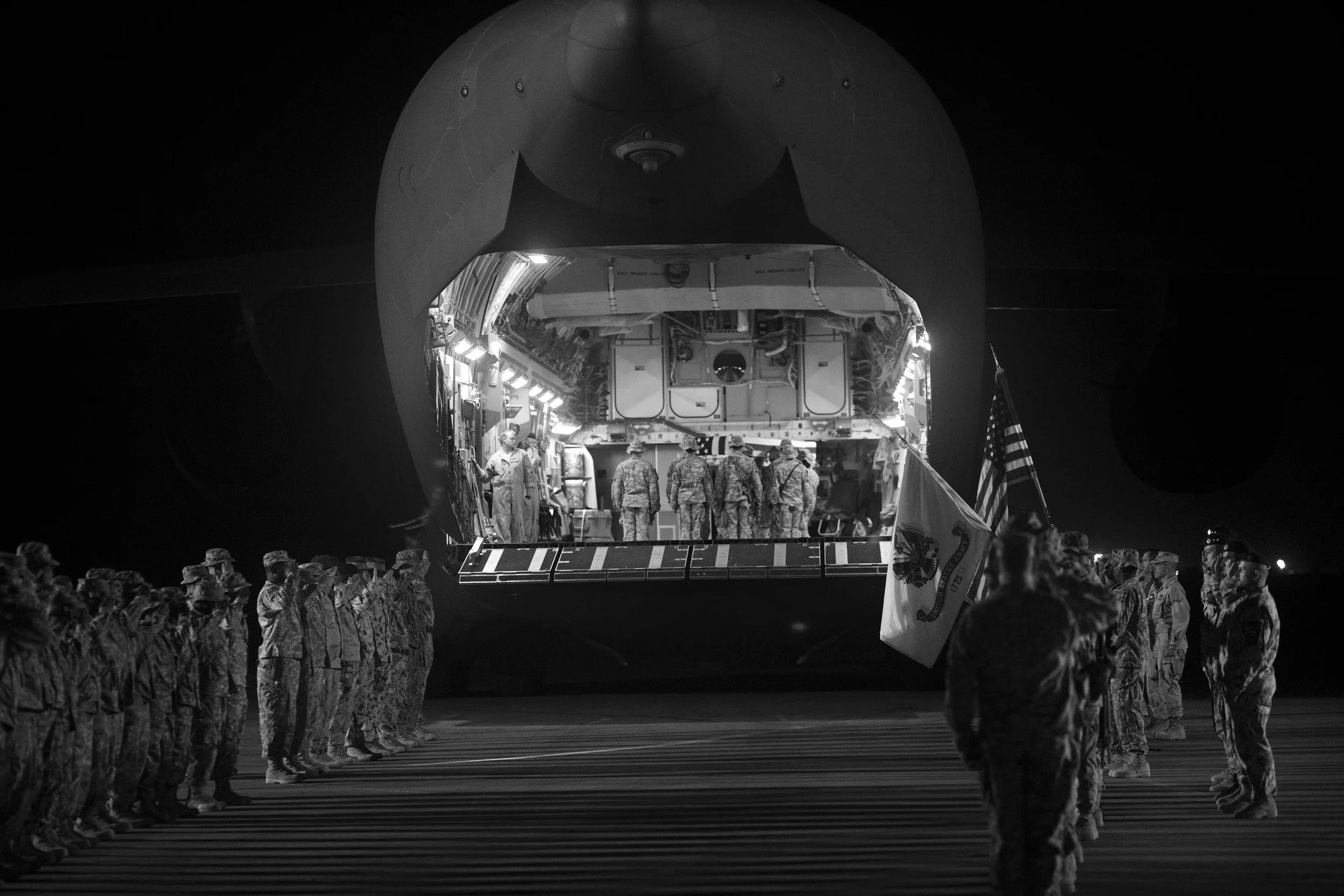  Soldiers salute at the ramp ceremony for Sgt. Patrick K. Durham and Spc. Andrew J. Castro killed in Babur. Kandahar Air Field. 