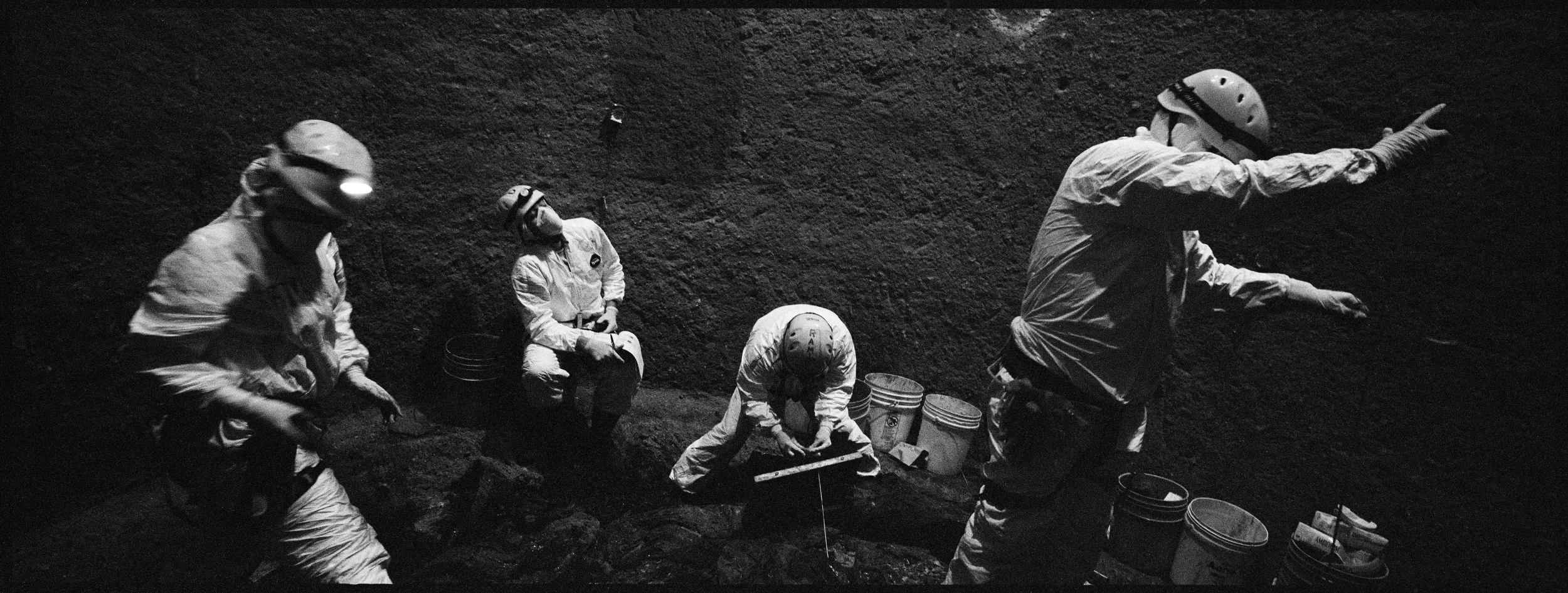  Anthropologists conduct an exhumation in an ossuary, La Verbena cemetery. 