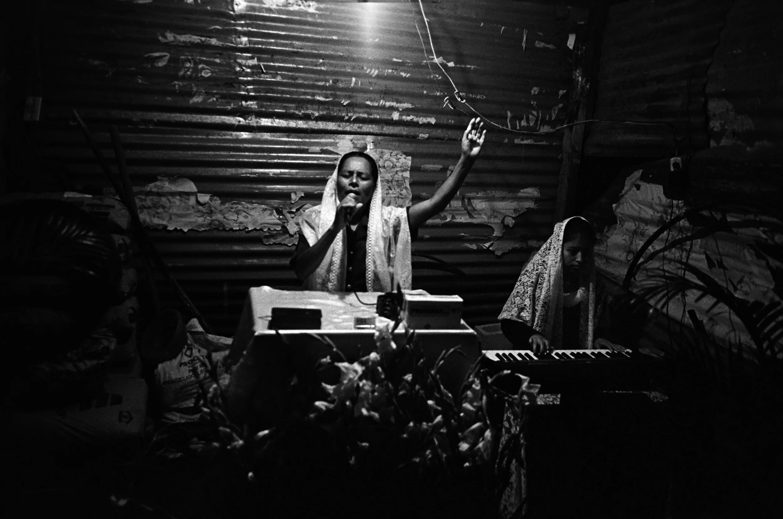  Marina Sinar sings and prays for her missing son. 