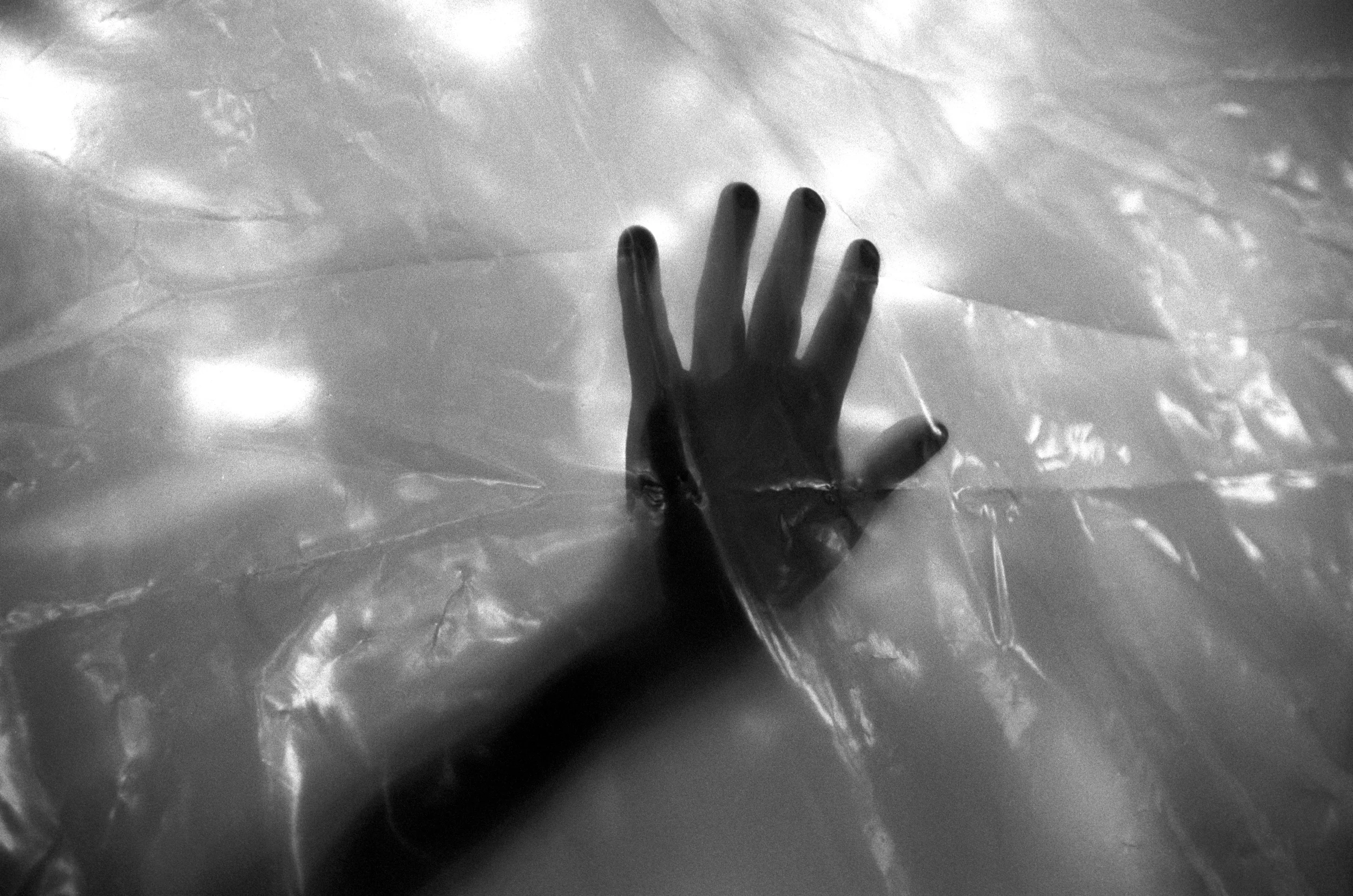  A squatter builds his shack from plastic sheets, Rancho Tres Hermanos. 
