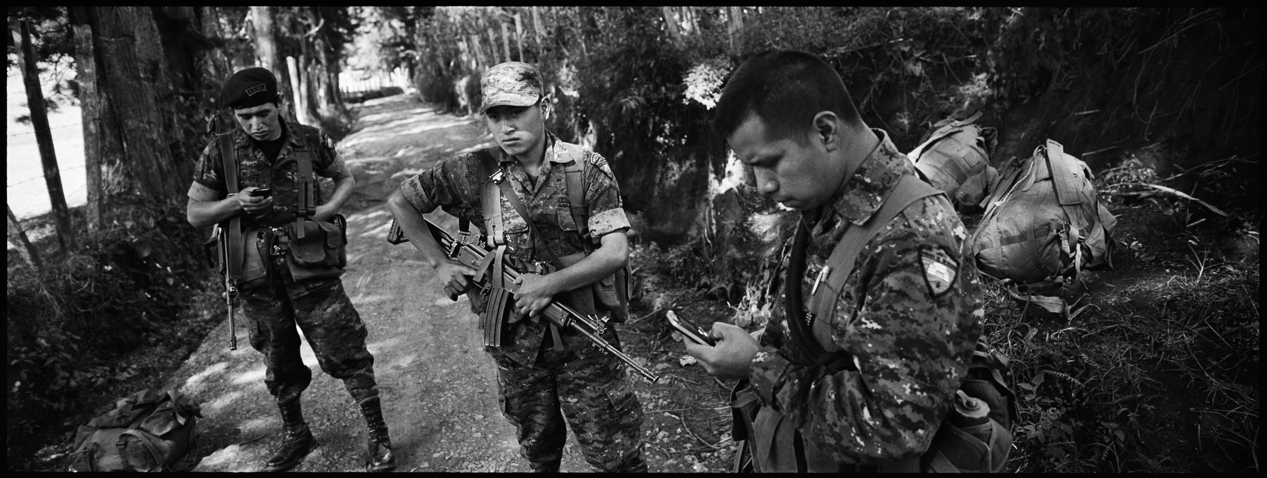  Members of the Kaibiles, the Guatemalan Special Forces, pause during a patrol in the hills above Nebaj, Quiche. 