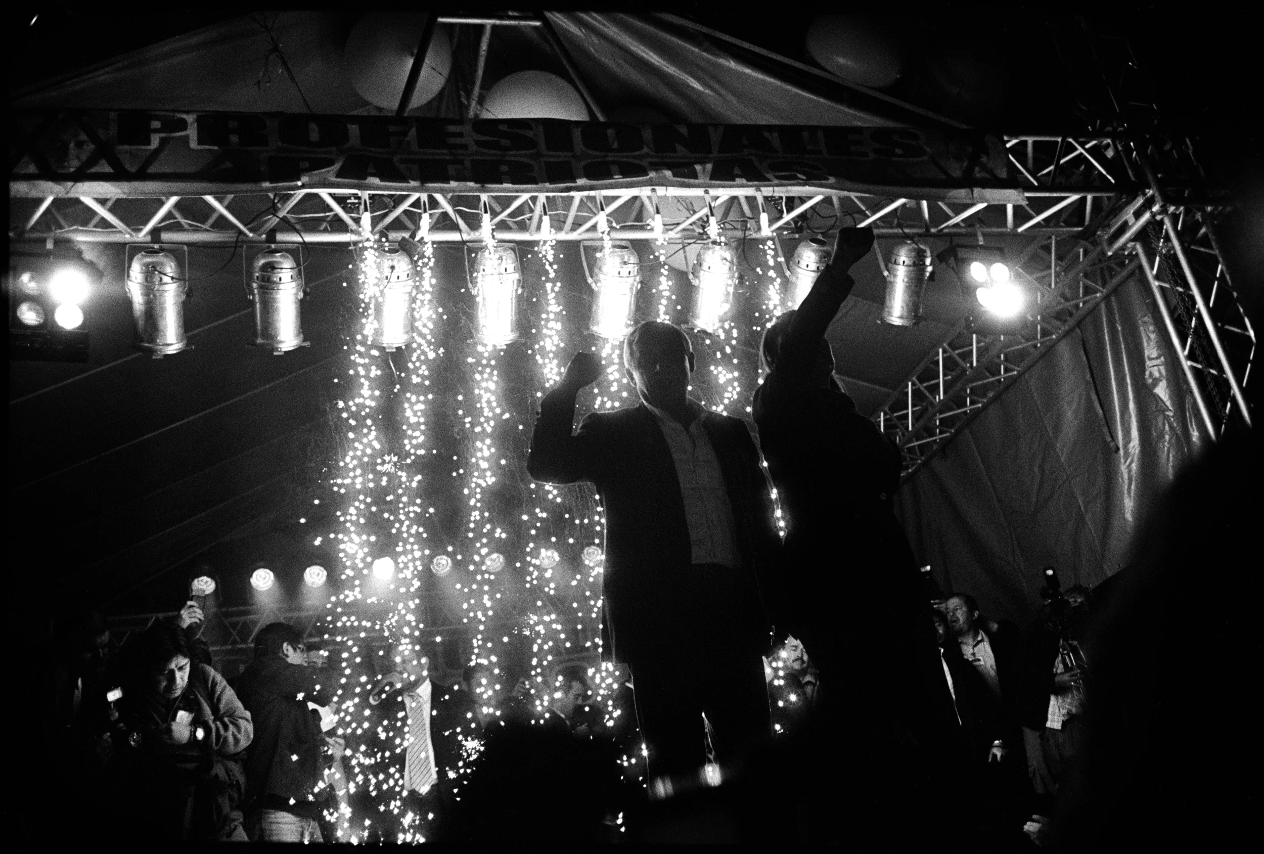  Otto Perez Molina, with his Vice President Roxana Baldetti, exhort their followers with his signature raised fist salute after winning the presidency. 