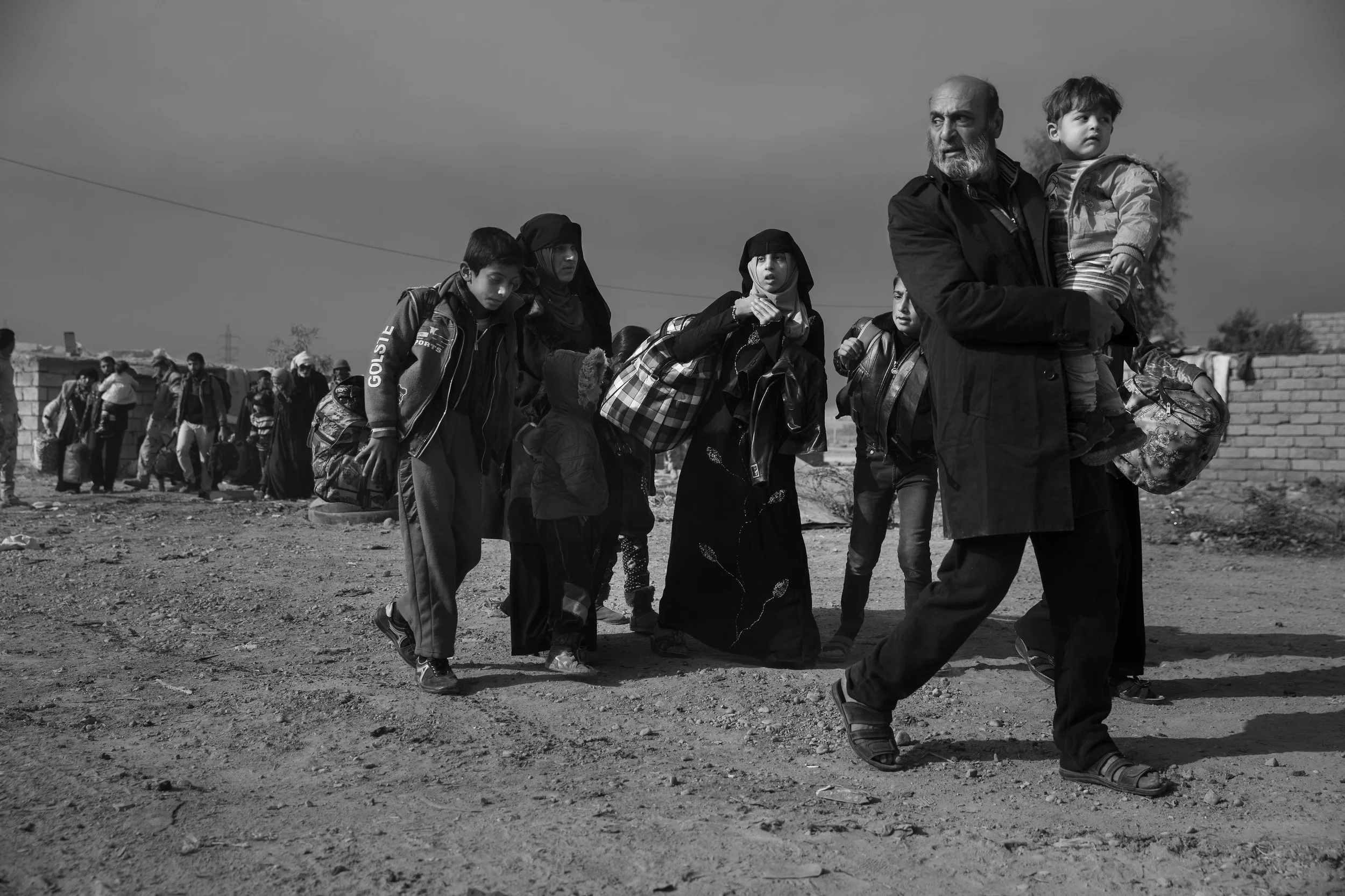  Refugees file out of the city. 