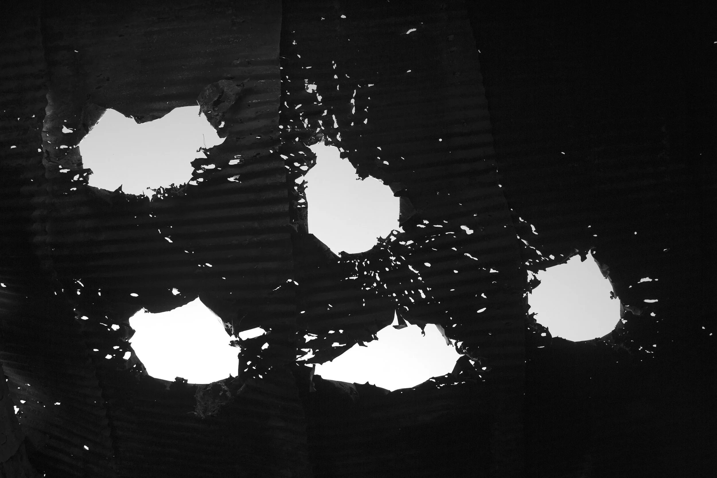  Holes in the roof of the MSF Kunduz hospital, punched by US 105mm artillery rounds. 