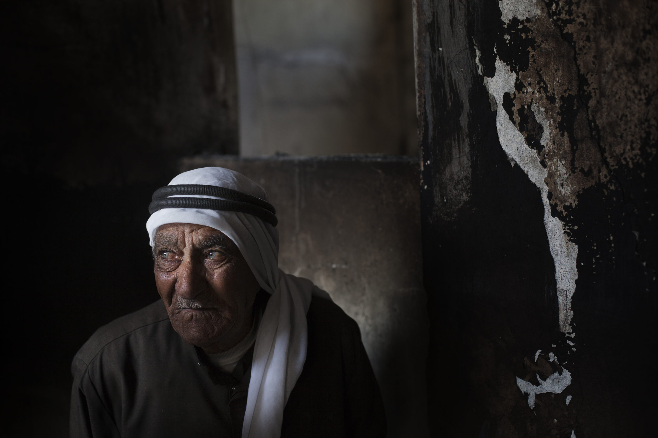  Ahmed Ghonim, 87, stands in the burnt home where his son, Mustafa was killed, Taftanaz. 