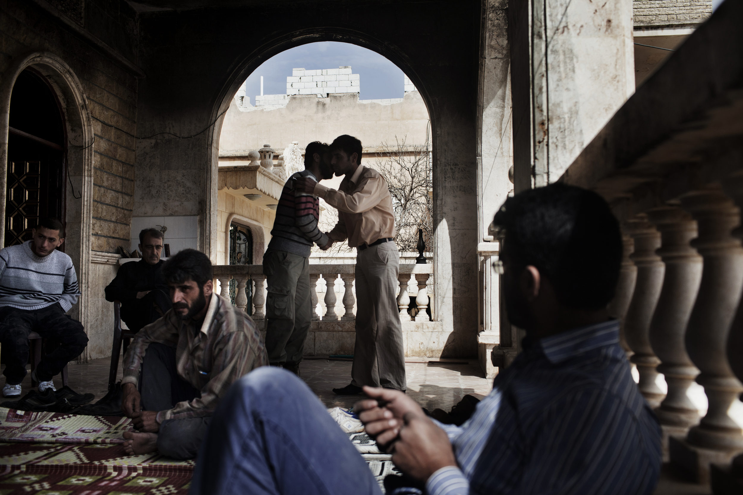  Members of the Gazal family grieve at their home.&nbsp; 