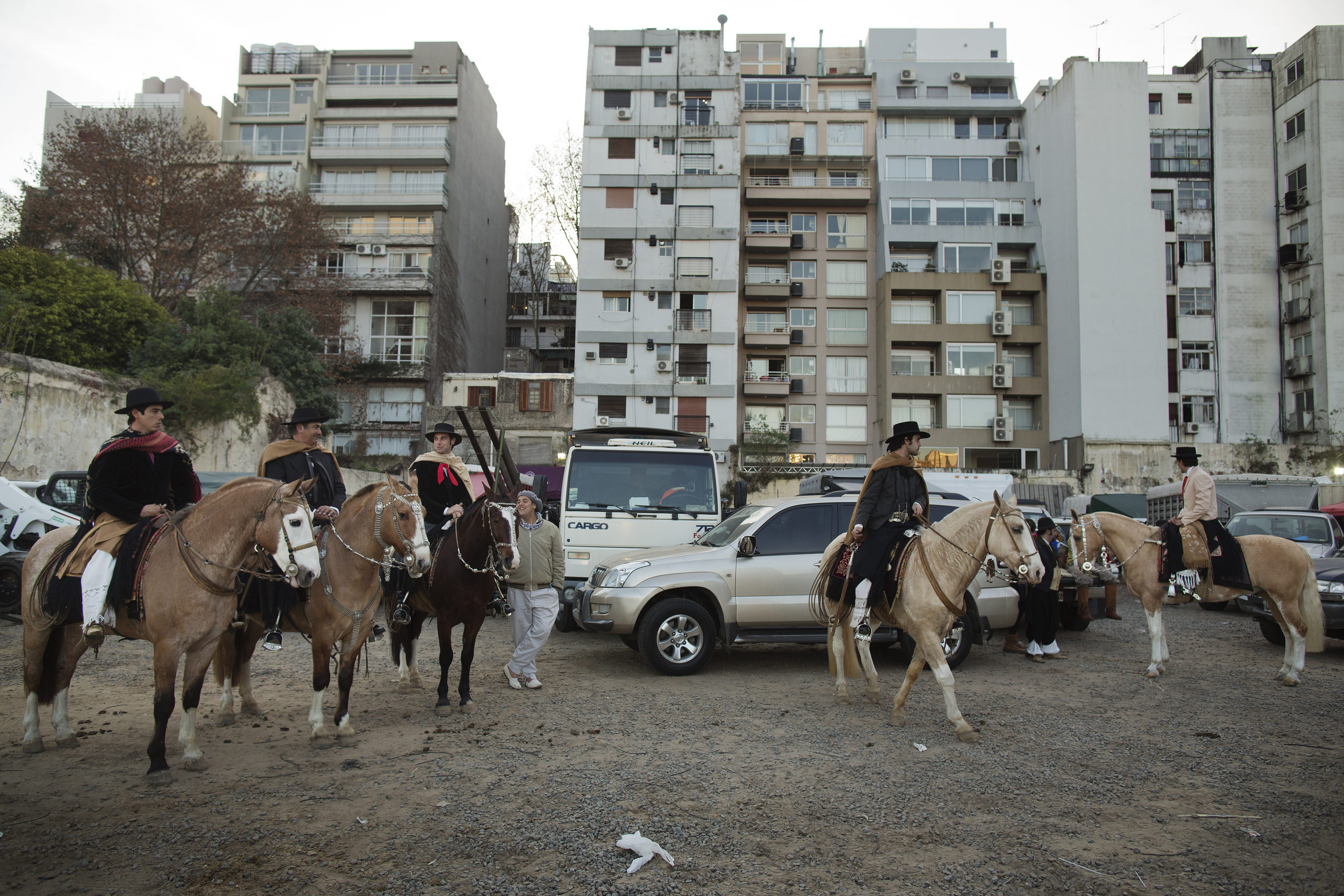  Pablo and a team of riders prepare to enter the ring in a suburb behind the Rural. 