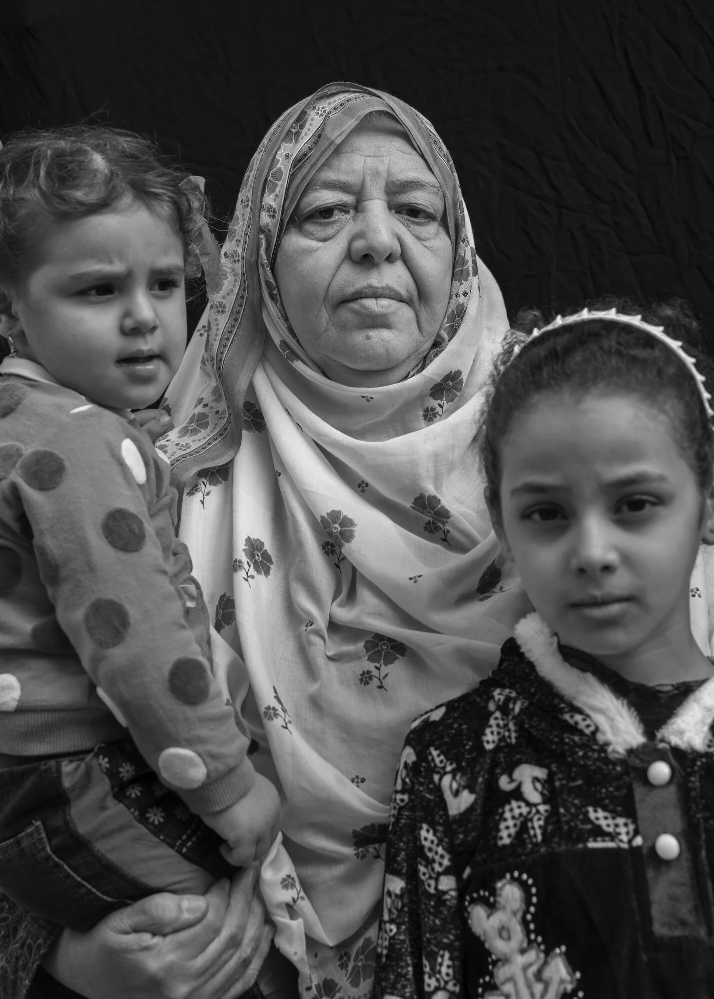  Hawla Mahdi Salah, 67, with her granddaughters Safae Khalid Adnan, 2, left, and Hawla Khalid Adnan, 9, right, Old City, Mosul.  On June 26, 2017, and airstrike destroyed their home while they were inside. “We realized the house was on our heads.” Ms