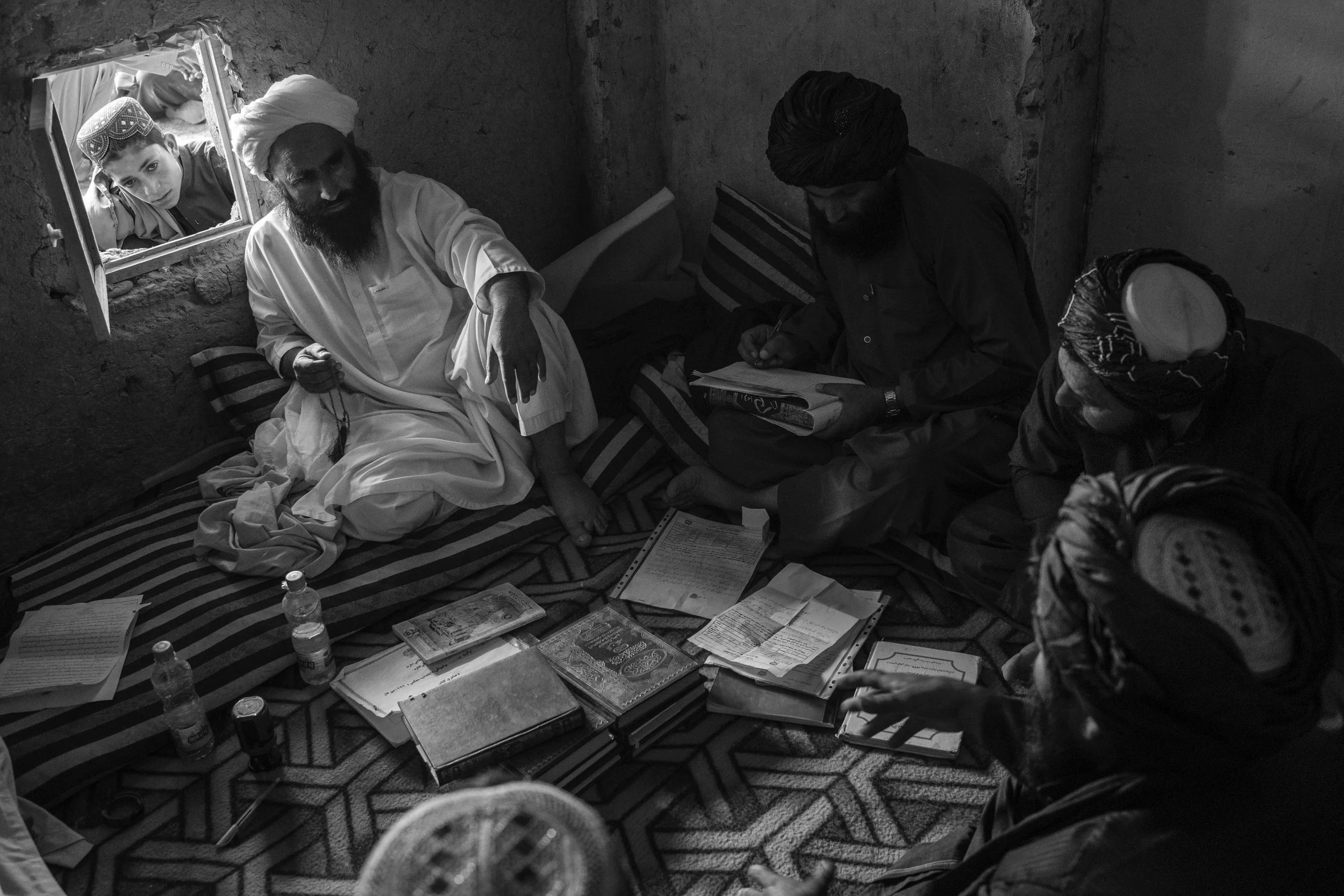  Taliban judge Abdul Sattar hears a case in his court room, Musa Qala, Helmand province.  