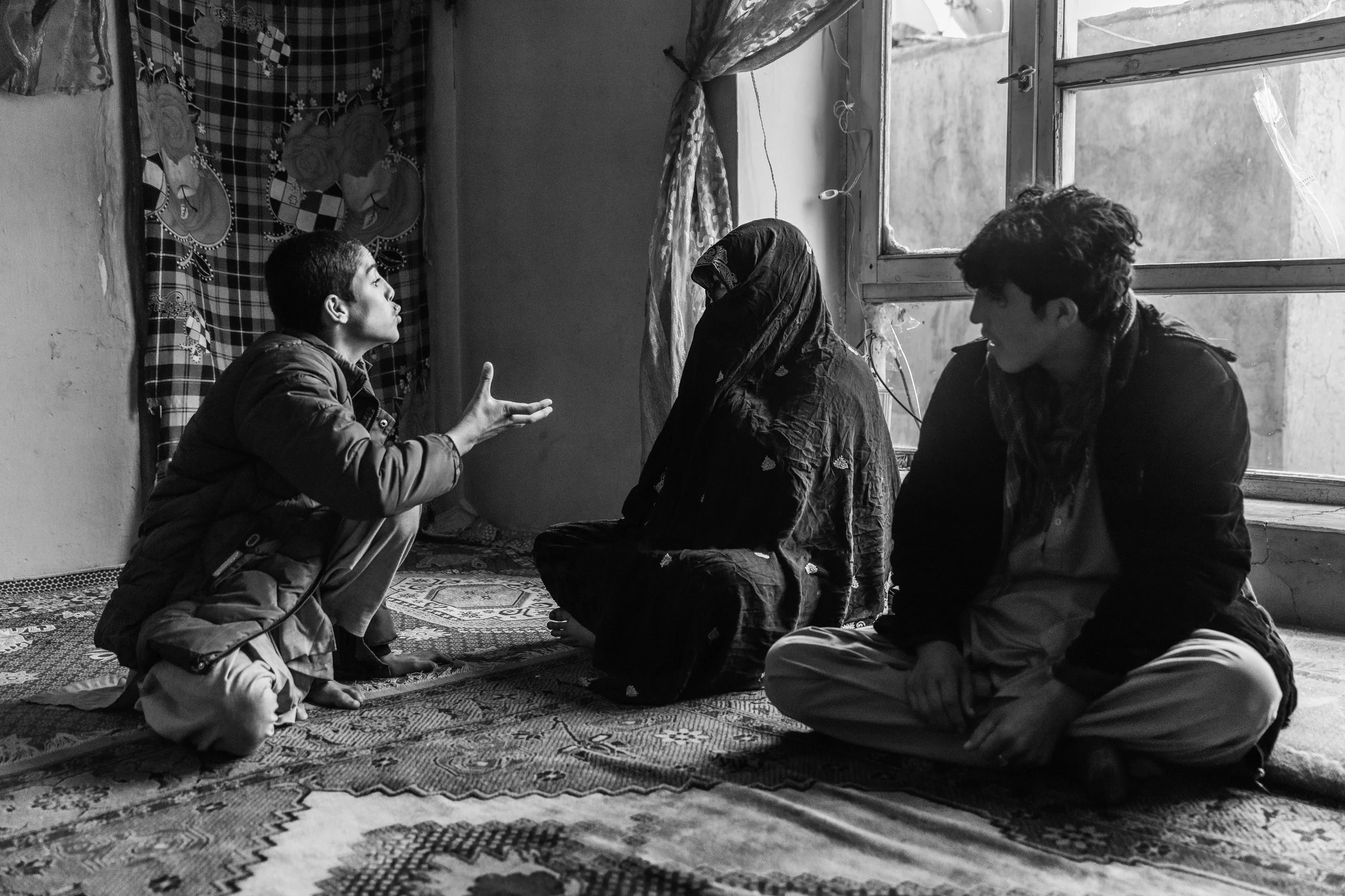 Omid tries to communicate to his deaf and mute mother Gul Lalai, who lost her husband and son to US Special Forces and their proxies, Wardak.  