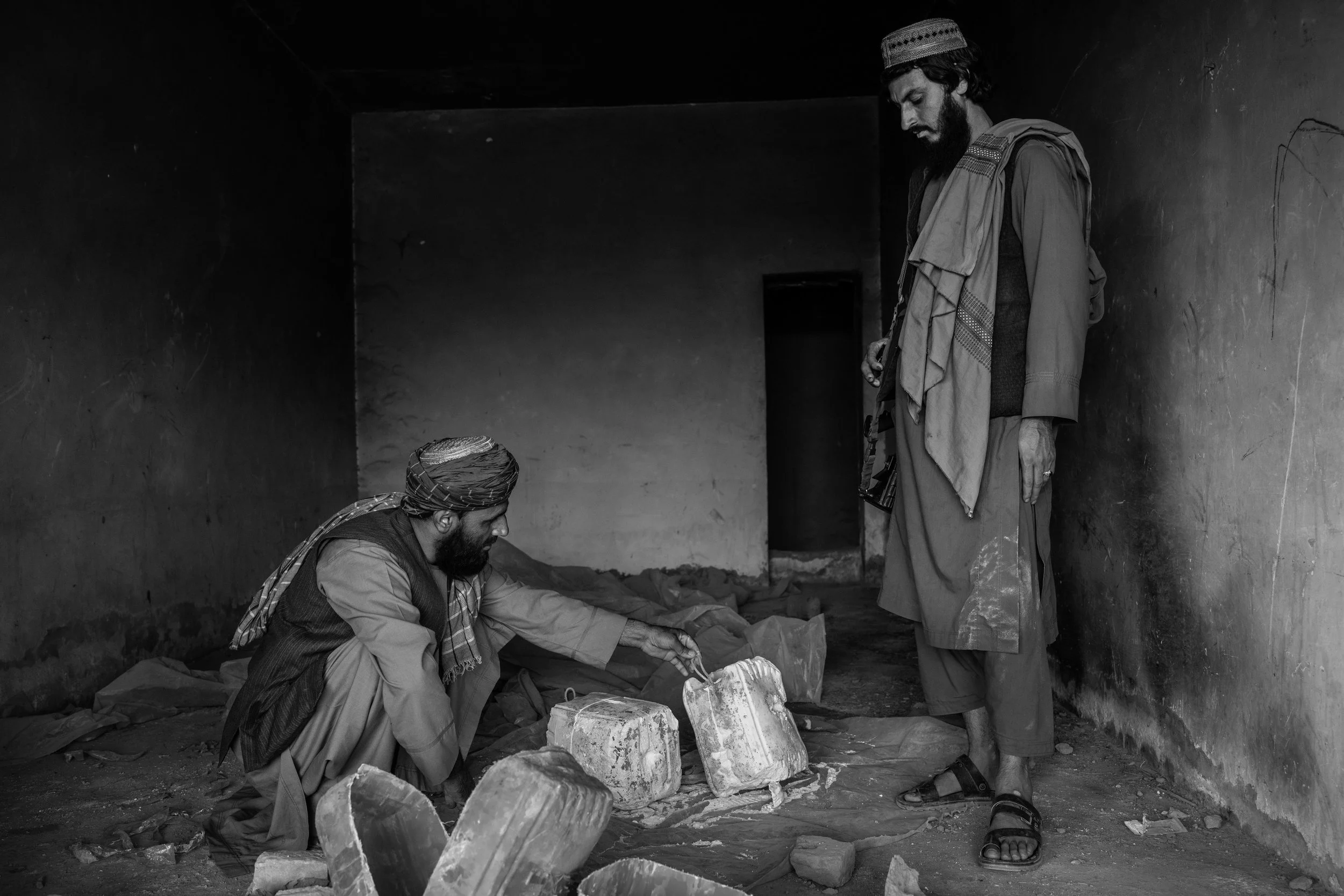  Taliban commander Mawlawi Rafiullah, 27, looks over decommissioned Taliban IED’s in Salawat, Kandahar. 