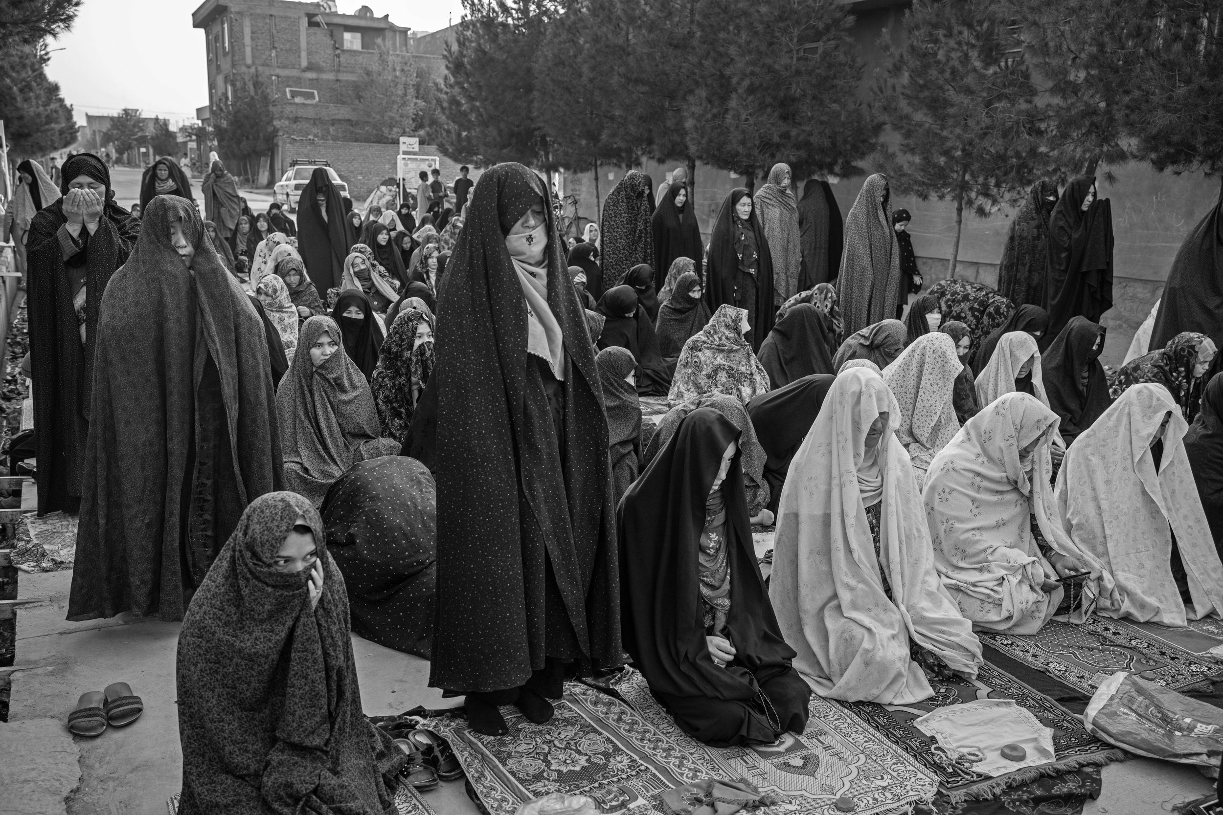  Women pray in the street for fear of earthquakes, Herat.  