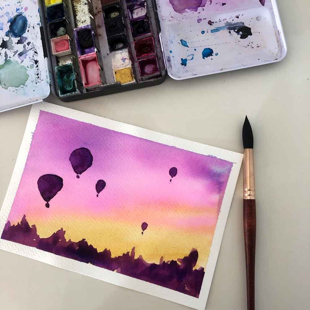 Watercolor Painting of Hot Air Balloons part of the better beginnings in watercolor course by Kerrie Woodhouse