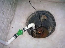 What is the difference between a sewage ejector pump and a sump pump?