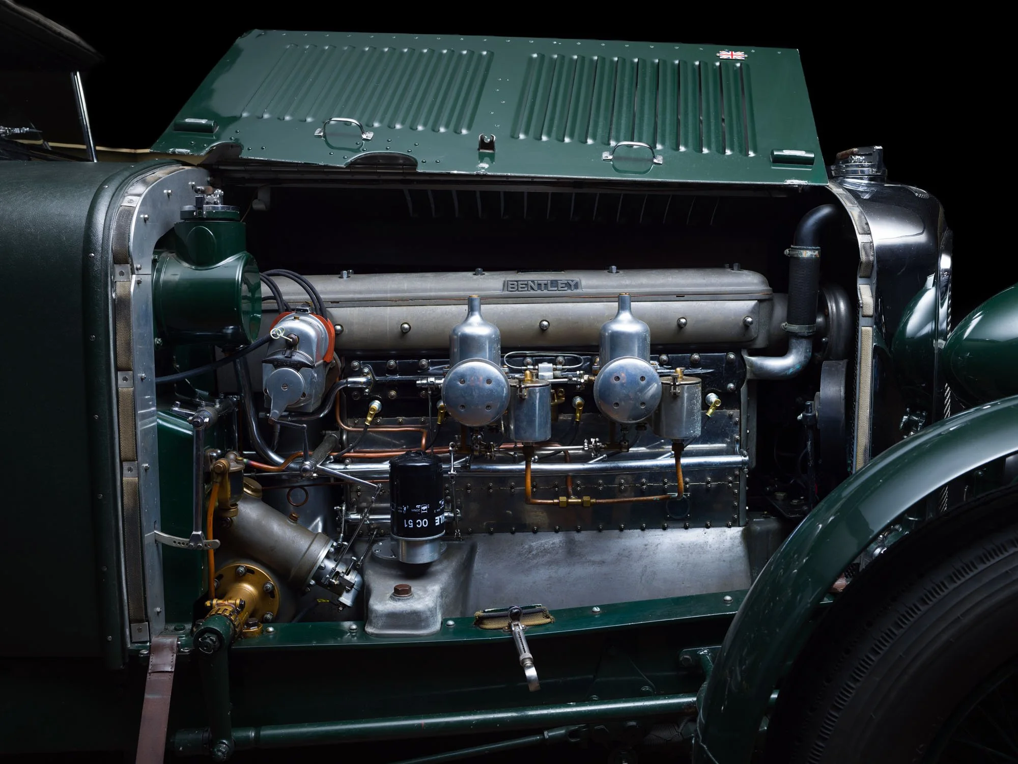 Engine detail inside a classic green car