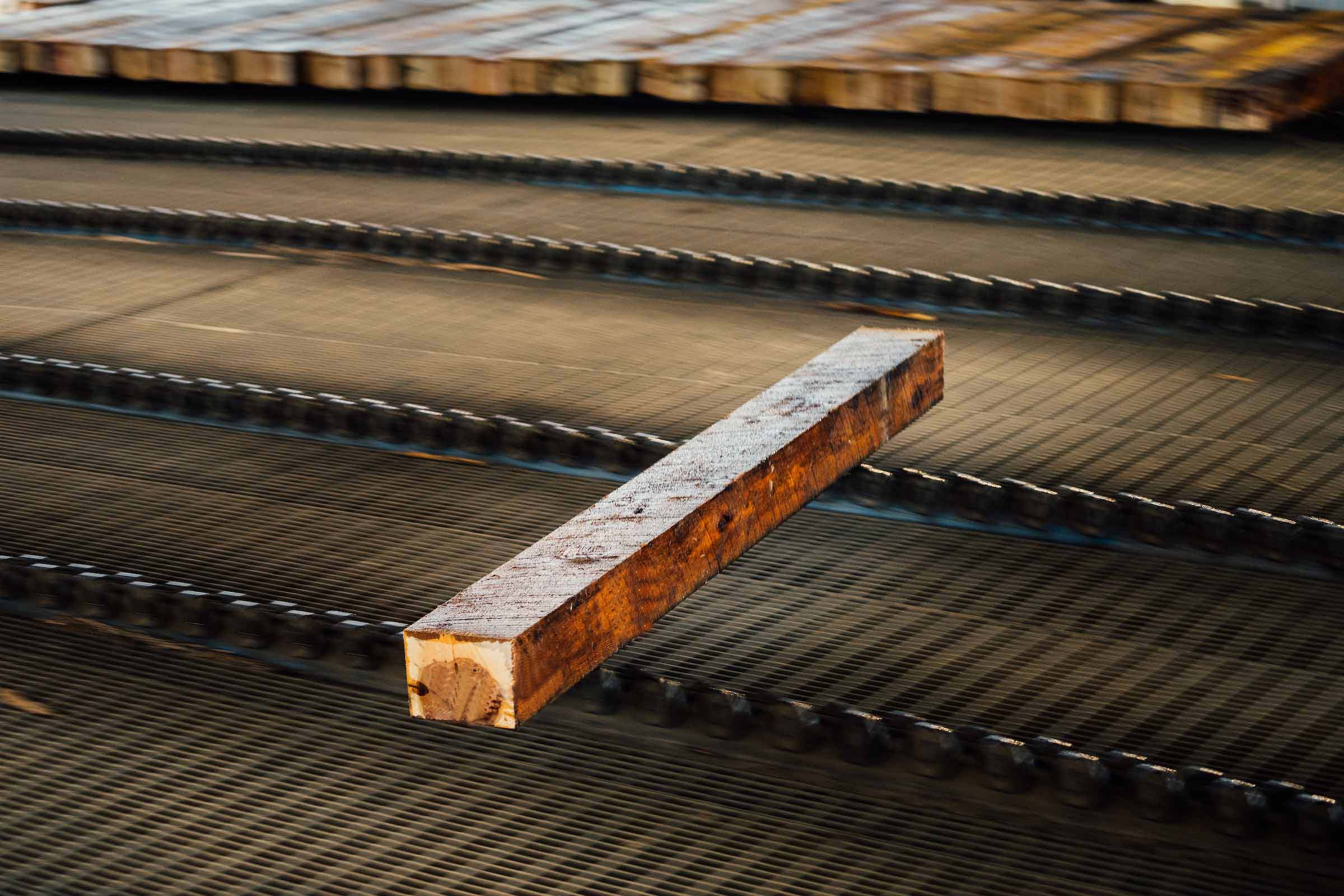 DRY TIES ARE PLACED IN AN AIR-TIGHT TREATING CYLINDER WHERE THEY ARE INJECTED WITH CREOSOTE AND OIL UNDER HEAT AND PRESSURE.