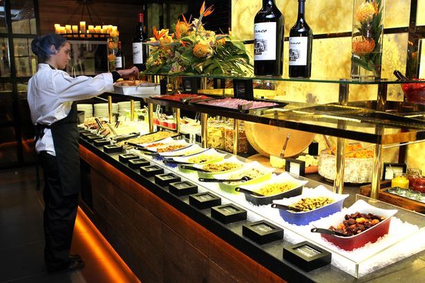 A typical presentation of foods one might see at an all you can eat buffet. 