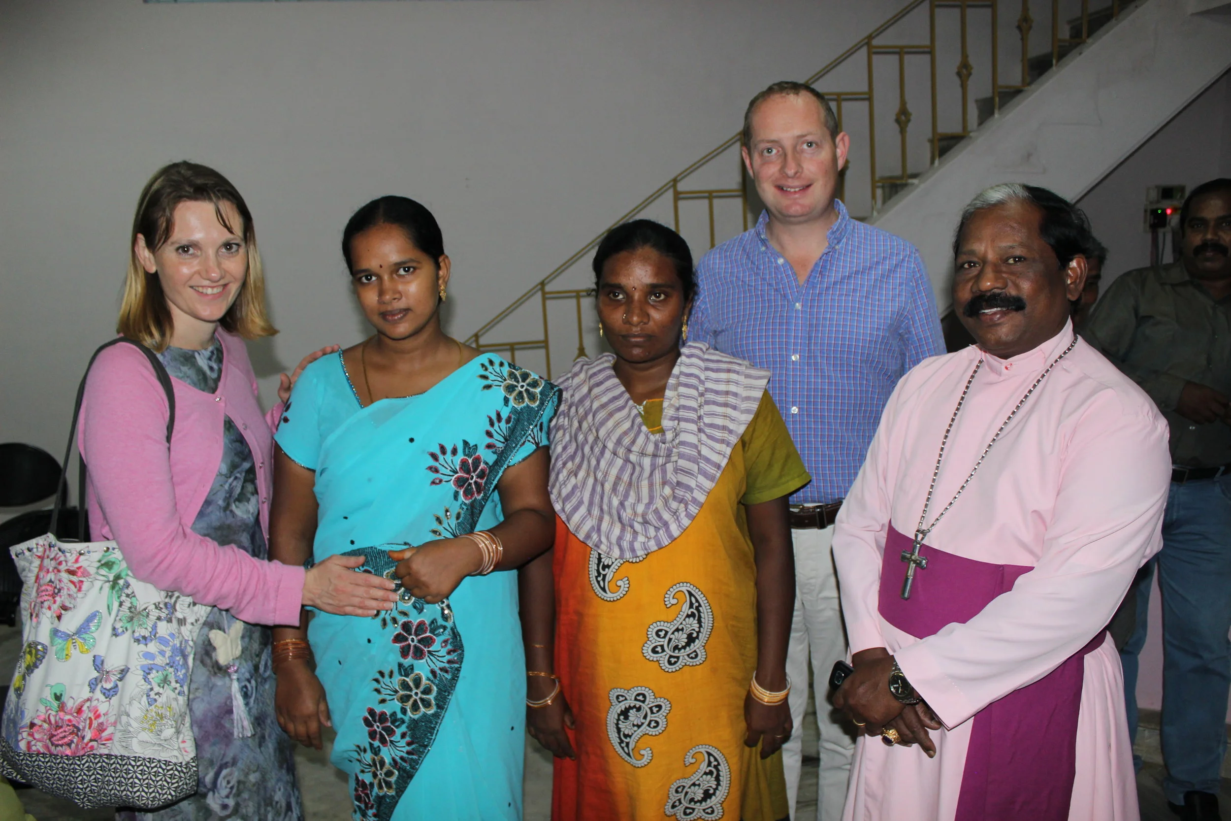 Left to Right: Sherry Secker, local pregnant women coming for medical care, Rev. Richard Lloyd, Archbishop Samuel