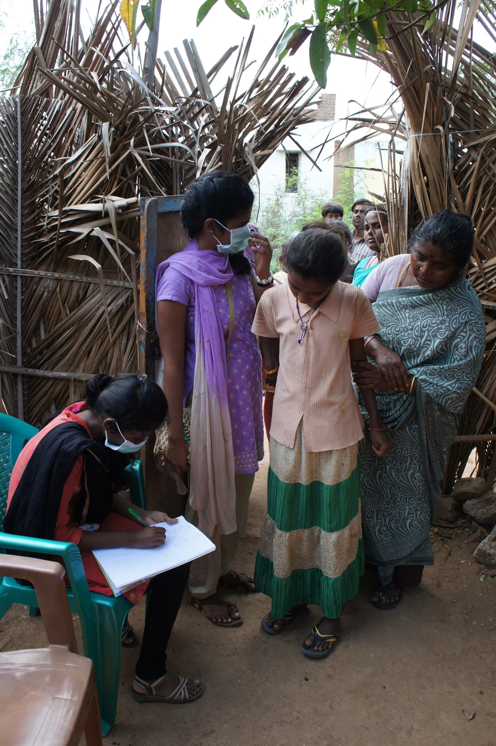 Bible College students - Thamaria and Meena at the gate registering patients