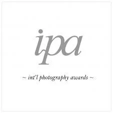 Logo for the International Photography Awards (IPA) featuring the lowercase letters 'ipa' and the text 'int'l photography awards' underneath.