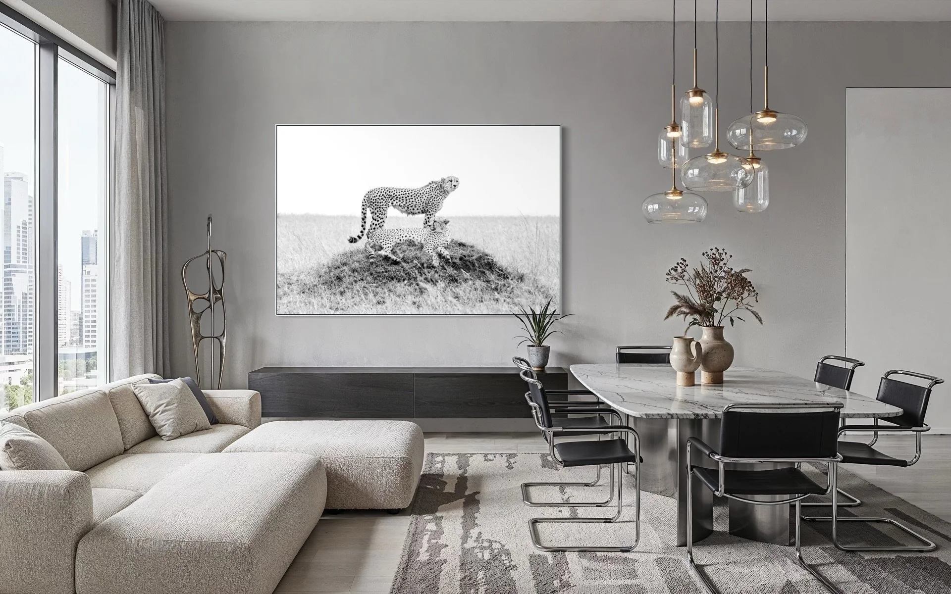 Large acrylic wall art of a black and white cheetah on a mound, displayed in a contemporary modern living room with city views.