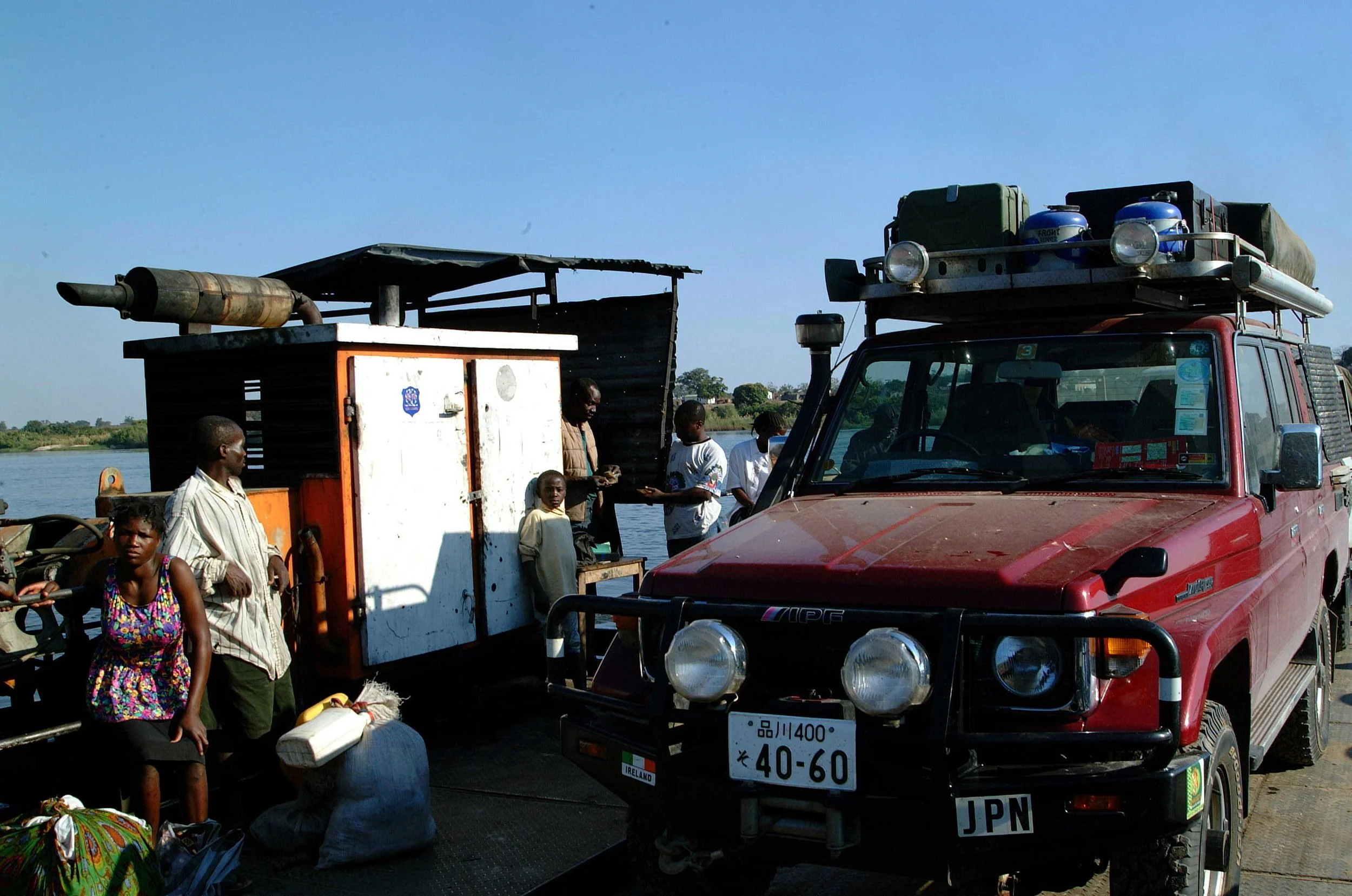 Toyota Land Cruiser crossing the Zambezi River on a remote African river crossing during overland expedition