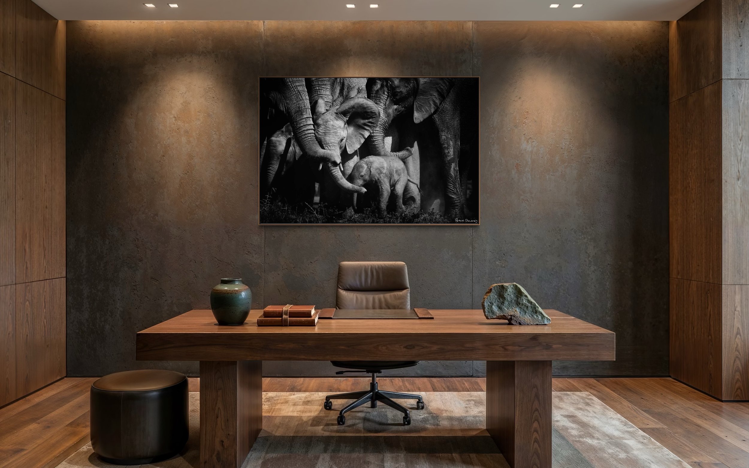Bonds of Love elephant family large acrylic print in an Asian-Western fusion study with wooden desk — black and white African wildlife art print by Peter Delaney