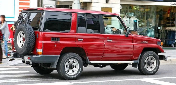 Photograph of a Toyota Landcruiser on a Tokyo street, the vehicle later shipped to Cape Town, South Africa, for a twelve-month overland journey across Africa