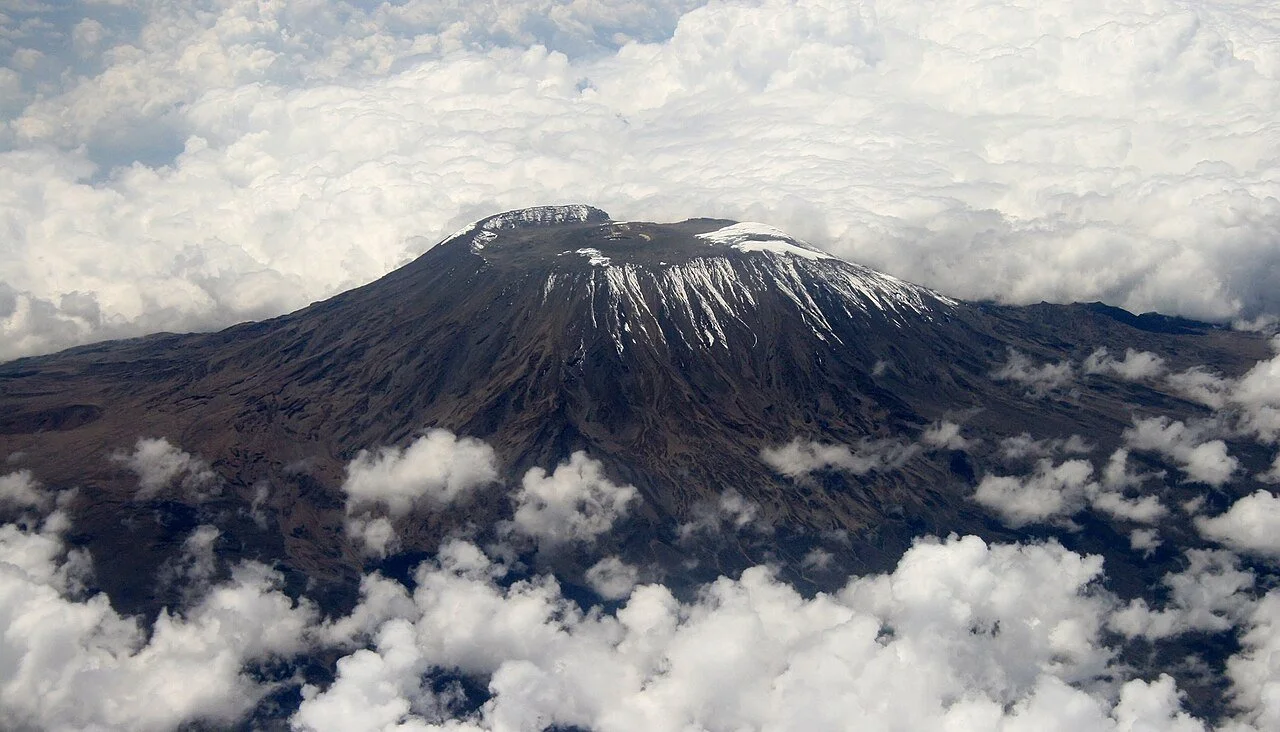 Aerial view of Mount Kilimanjaro rising above a sea of clouds in Tanzania By Muhammad Mahdi Karim - Own work