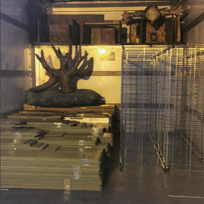 The truck loaded up with floorboards, shelves and sets