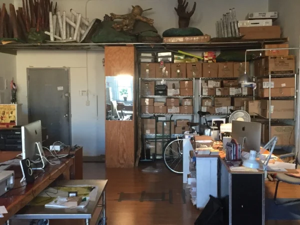 Studio workspace area with storage space near entrance