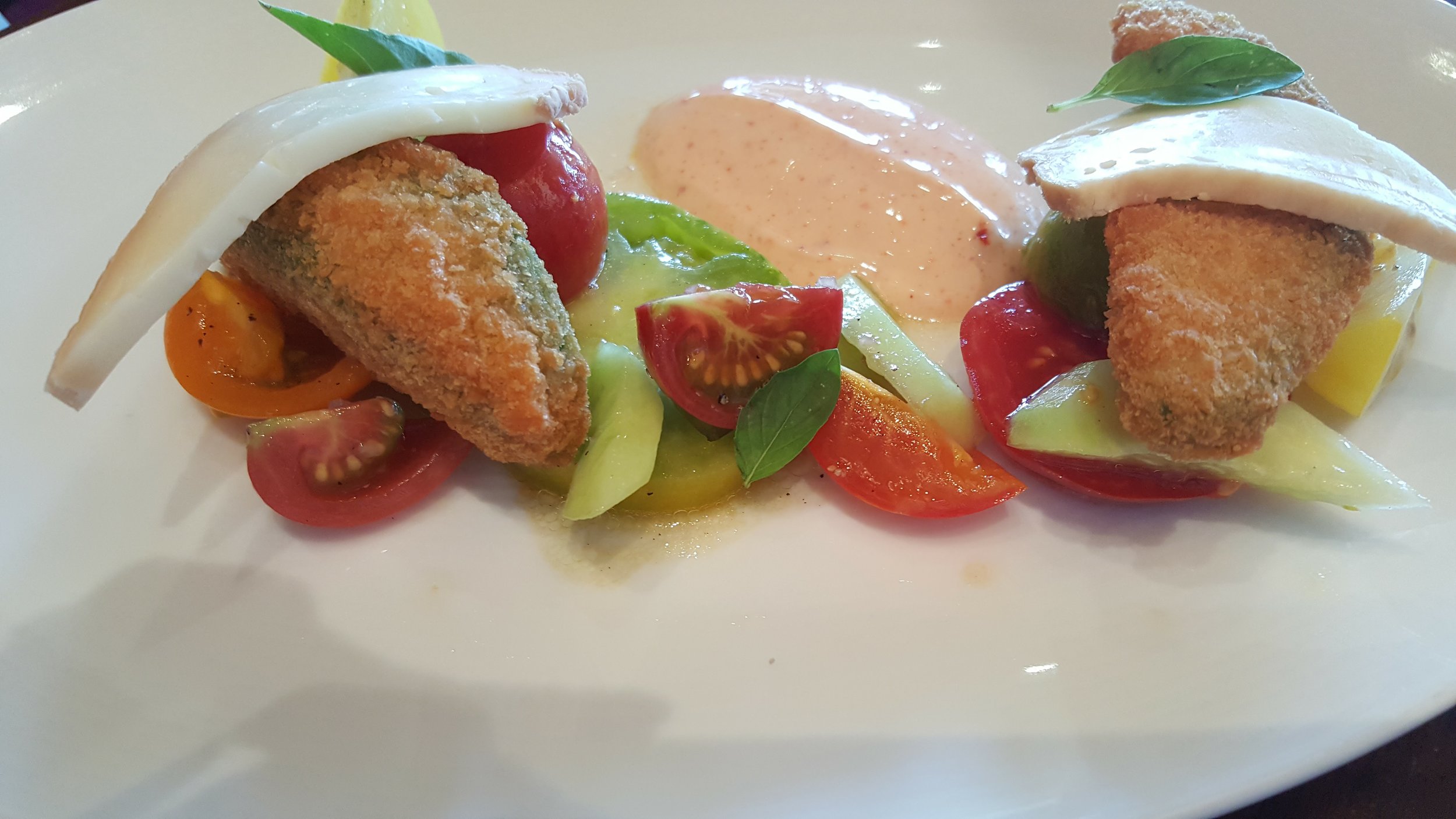 Heirloom Tomato Salad with Flash Fried Avocados .. The tomatoes are from the Restaurant's organic garden