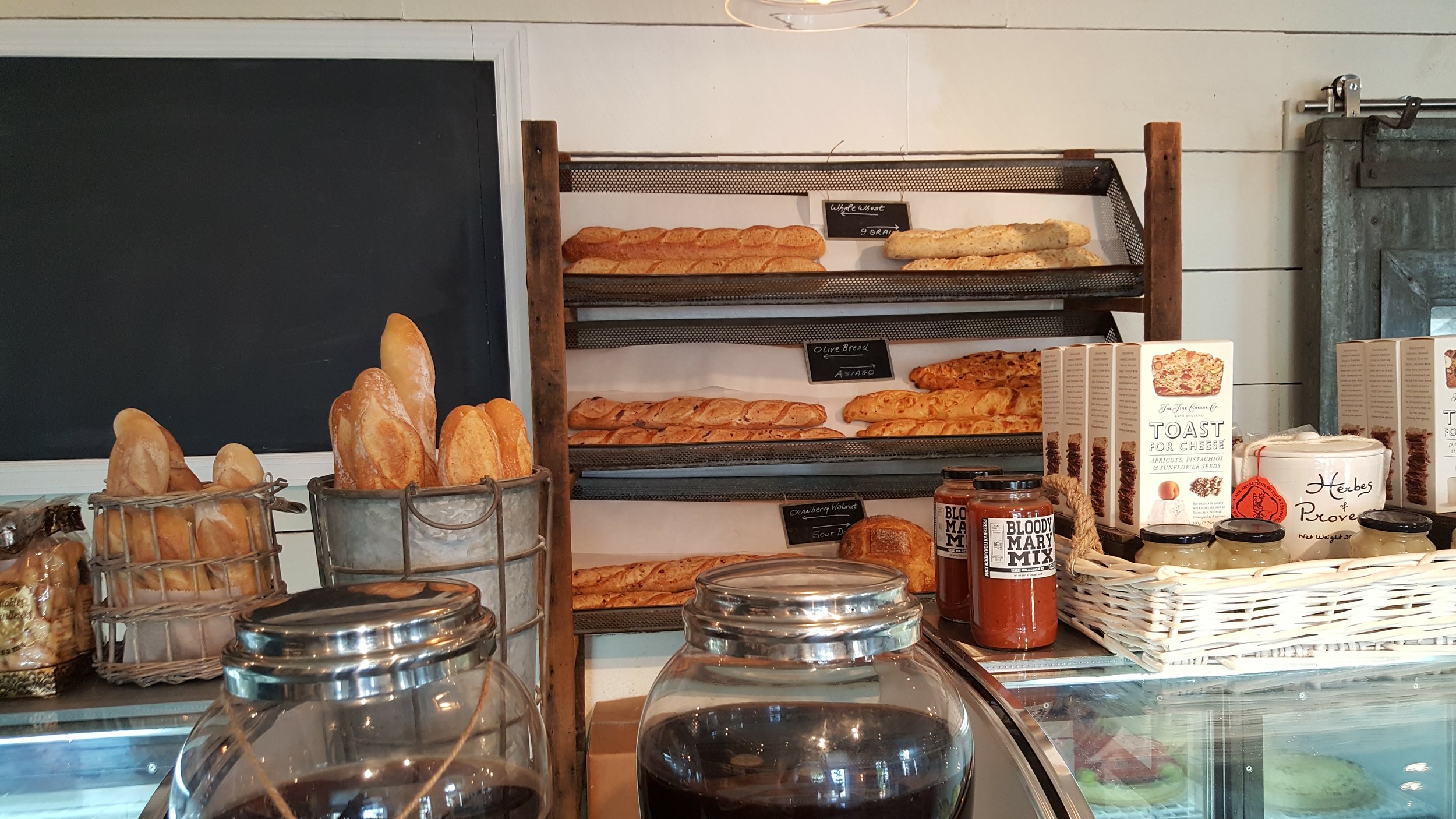 Fresh baked breads line the counters