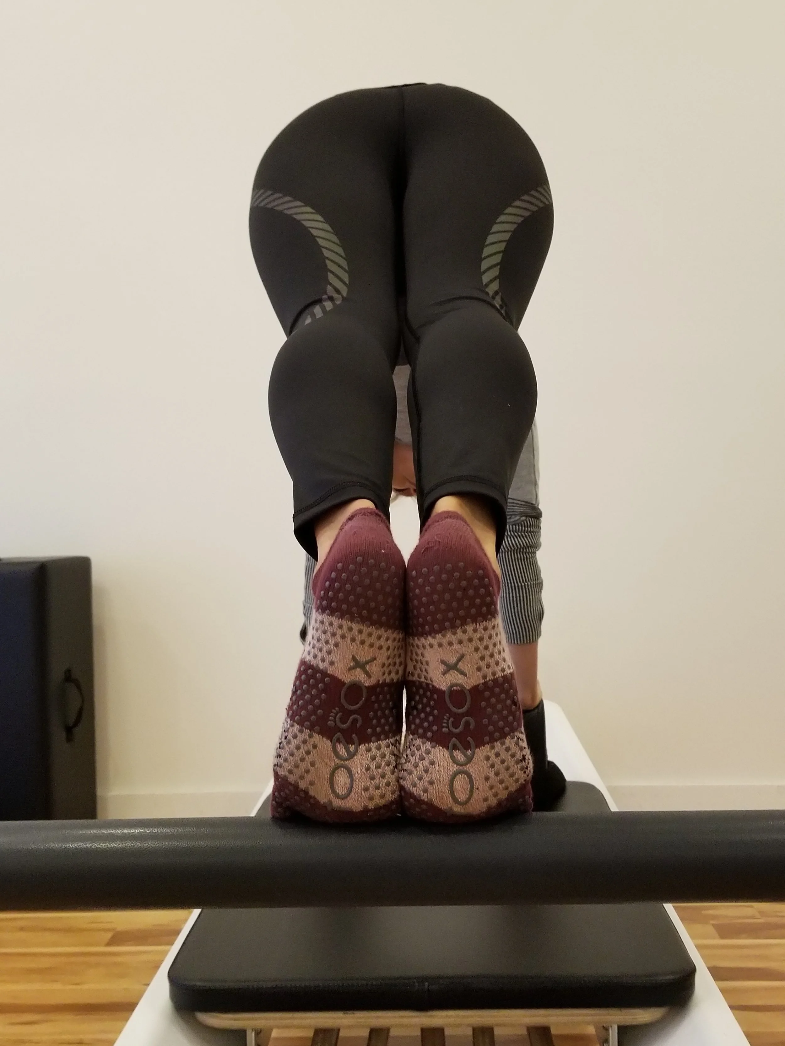 Athleta's Spectrum Sonar Tight hugs everything in and stays put while practicing Pilates or Yoga!