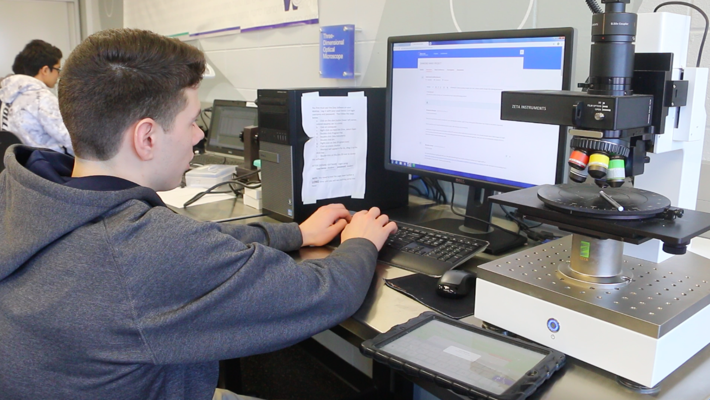 Wheeling High school senior Brandon Zettek works on a project in his college introduction to nanotechnology class.