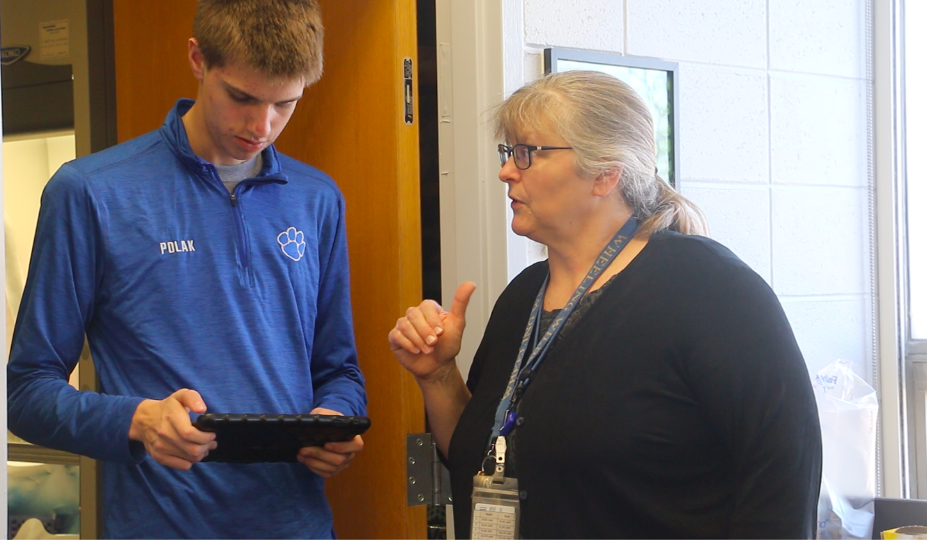Carol Bouvier works with a Wheeling High School student. Bouvier signed up her students for District 214's Mentor Matching Engine platform, giving the students the opportunity to connect with industry professionals to explore careers and get feedback on their work.