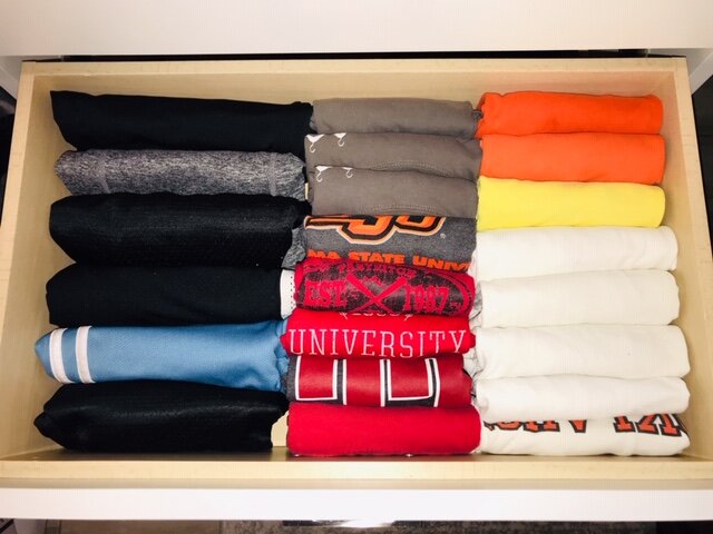 Keep T-shirts and gym shorts compactly folded instead of taking up valuable hanging space. Call Closets of Tulsa today for a  FREE virtual consultation and 3-D closet design :  918.609.0214