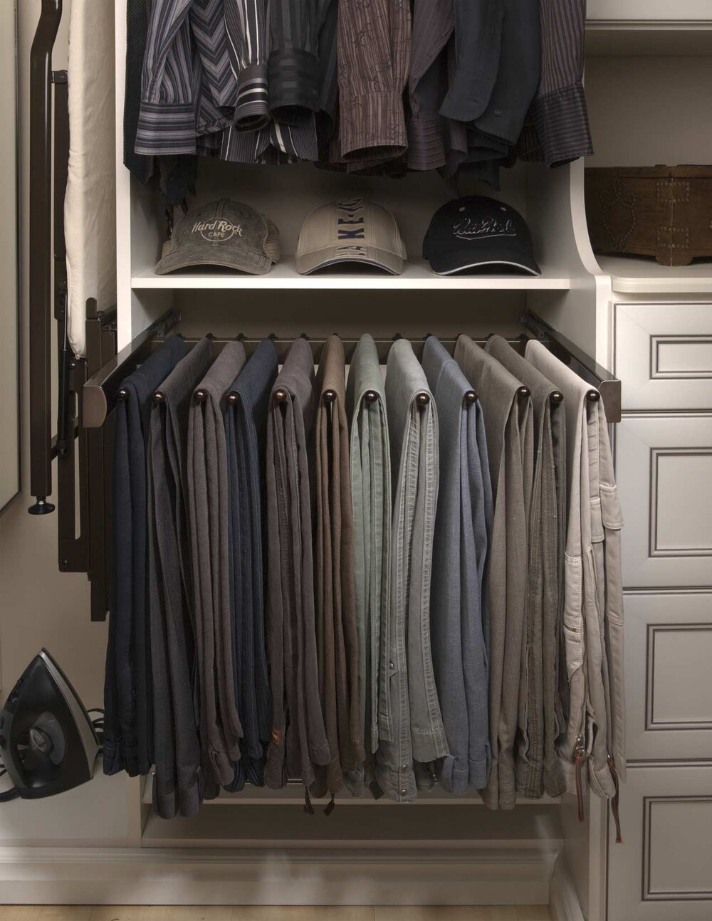 This minimalist slide out pants rack by Closets of Tulsa is shown in Oil Rubbed Bronze. Call now for a  FREE virtual consultation and 3-D closet design :  918.609.0214