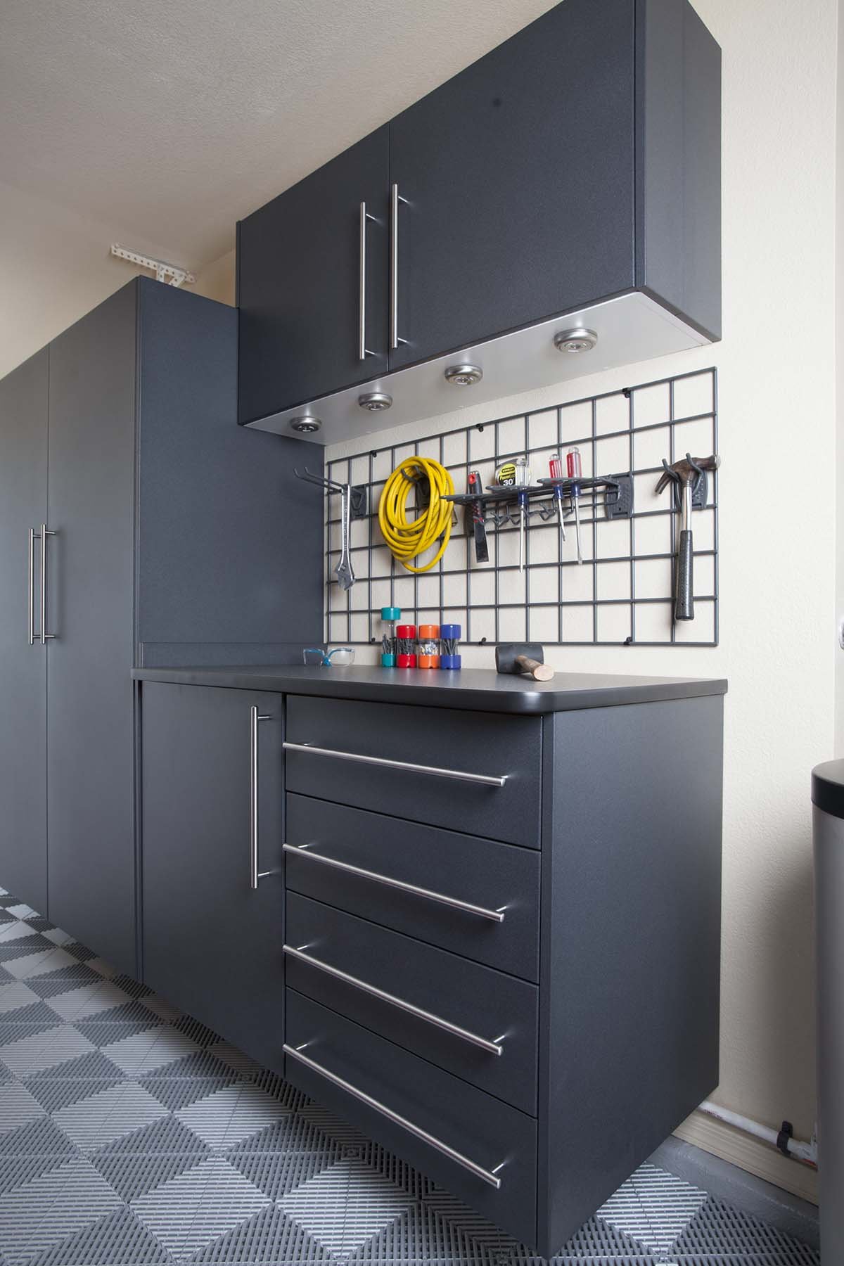 Granite Workbench with Ebony Star-Grey Swiss Trax-Grid with Tools-Side Angle - Not Touched Up.jpg