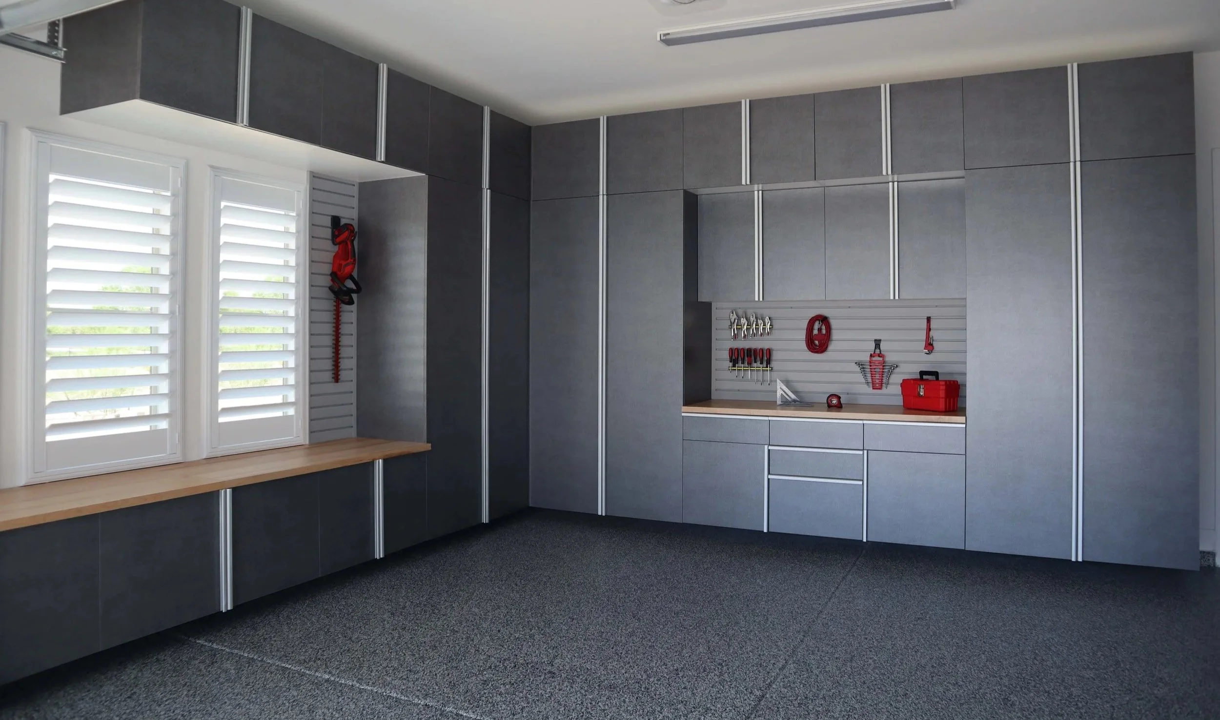 Pewter-Cabinets-with-Butcher-Block-Countertop-and-Grey-Slatwall-Angle-June-2021.jpg