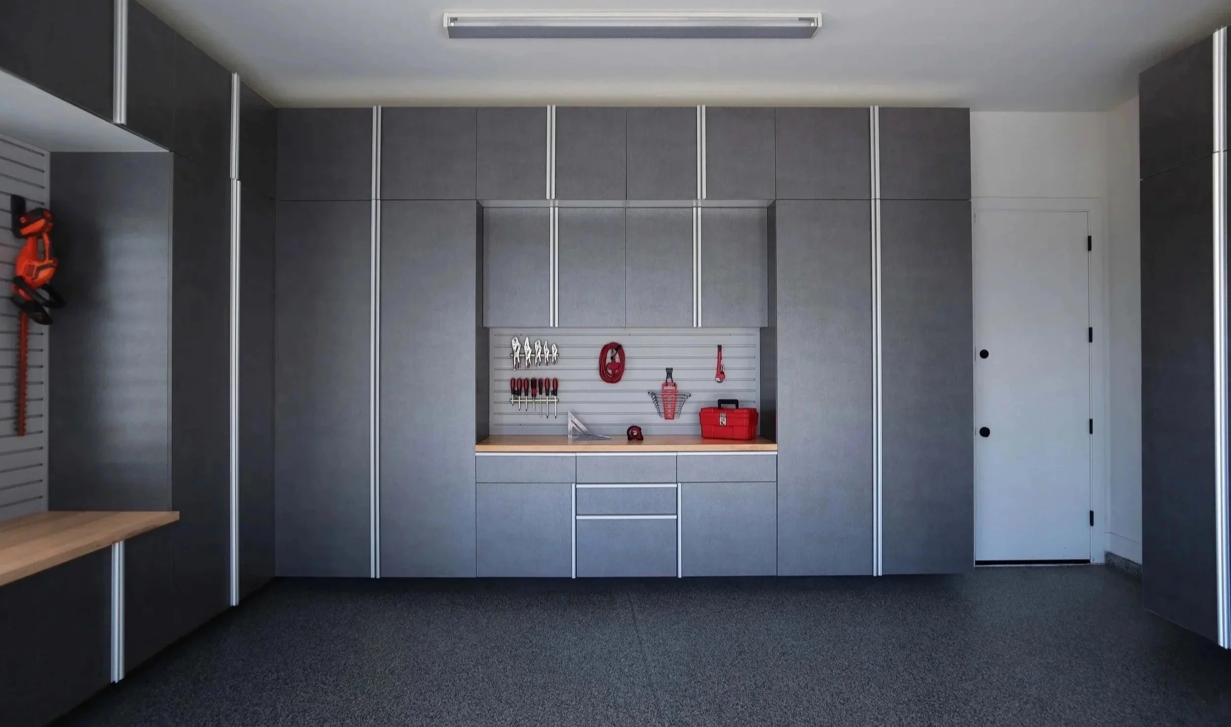 Pewter-Cabinets-with-Butcher-Block-Countertop-and-Grey-Slatwall-June-2021.jpg