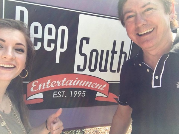 President Dave Rose and Account Manager Mandelyn Monchick in front of the Deep South office sign at the Nashville office on Music Row. 