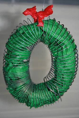 A slinky, a birdhouse, a pile of rocks and a plate of cookies.
