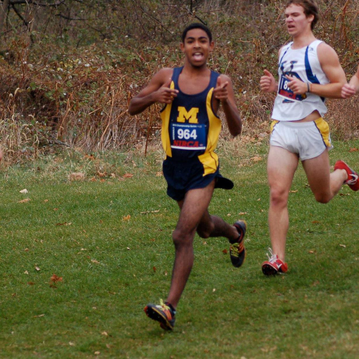 John running Cross Country for UMich