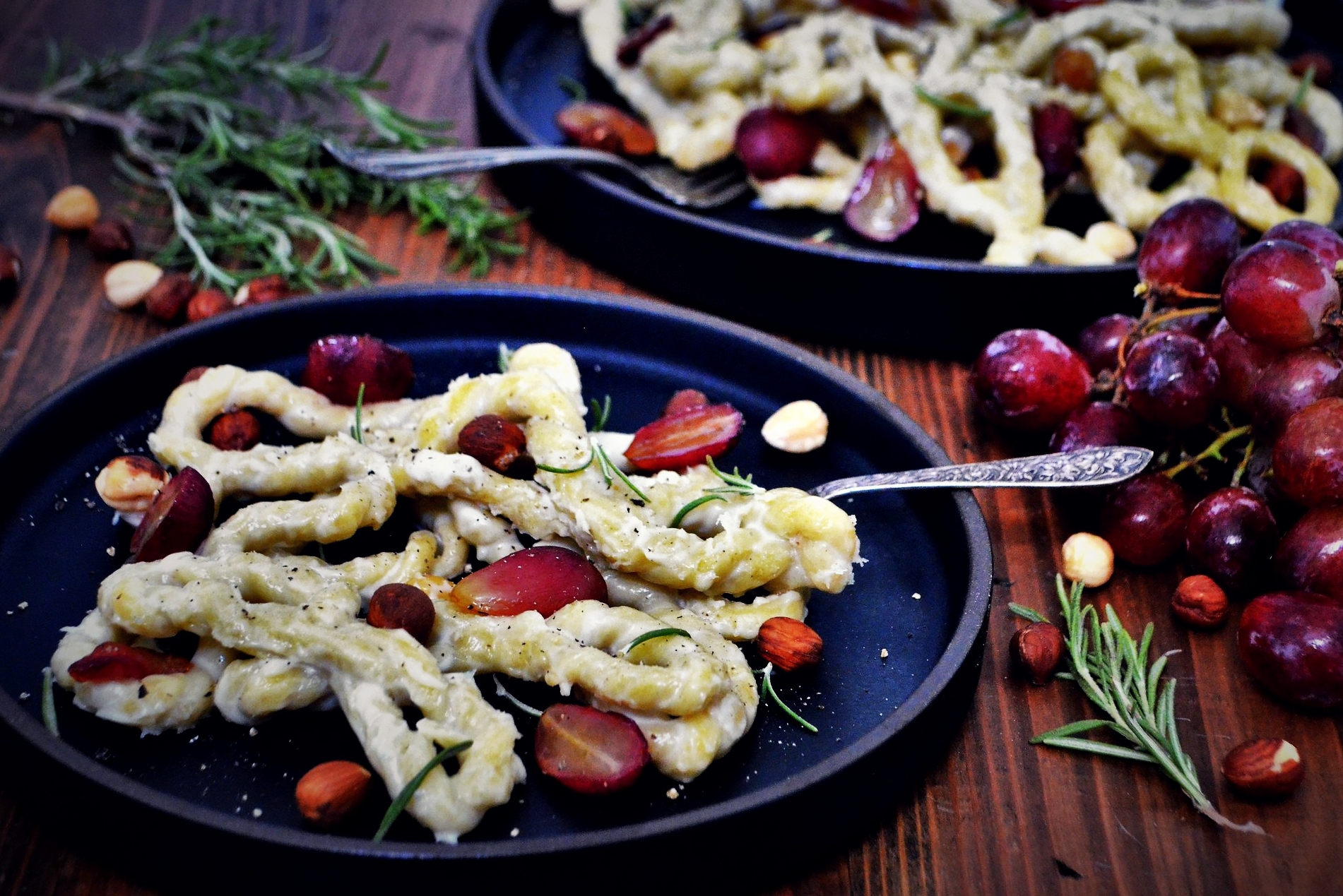 Infinity Lorighittas in Blue Cheese Sauce with Roasted Grapes and Hazelnuts